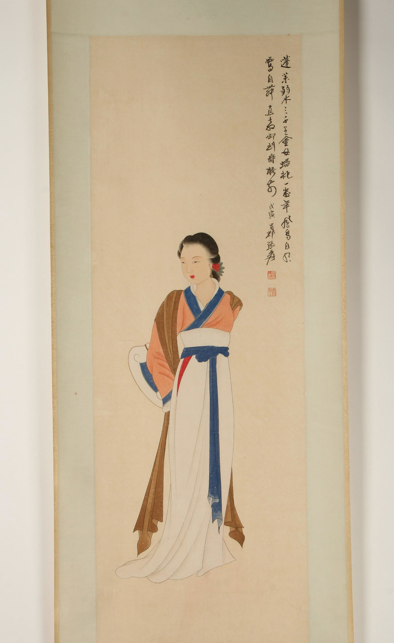 SCROLL OF BEAUTY WITH A SCROLL: The beauty is draped in robes holding a scroll. Calligraphy and artist mark on right. 24" X 79" $400 - $600 Please contact us for high resolution images of this lot. Shipping:<