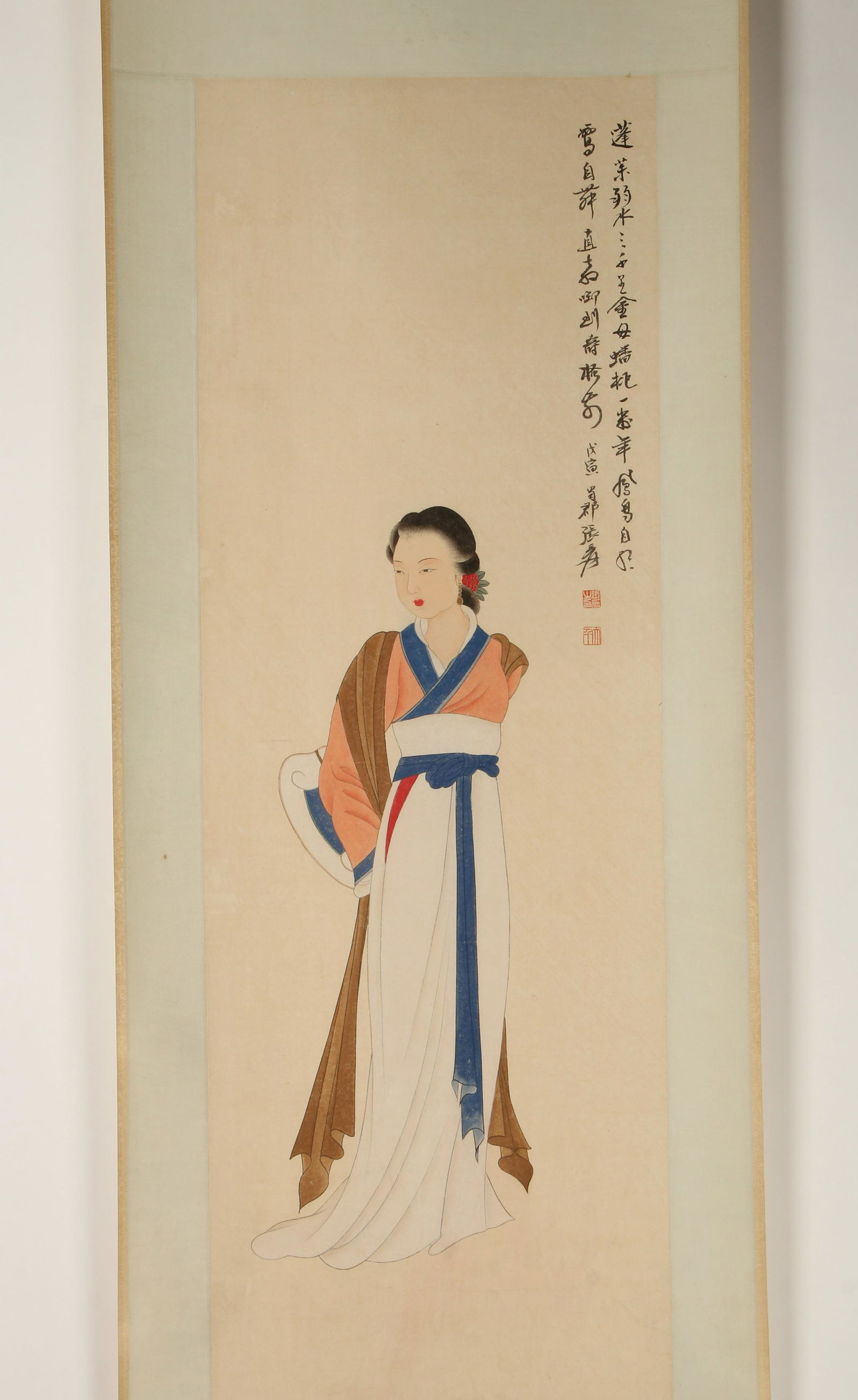 SCROLL OF BEAUTY WITH A SCROLL: The beauty is draped in robes holding a scroll. Calligraphy and artist mark on right. 24" X 79" $400 - $600 Please contact us for high resolution images of this lot. Shipping:<