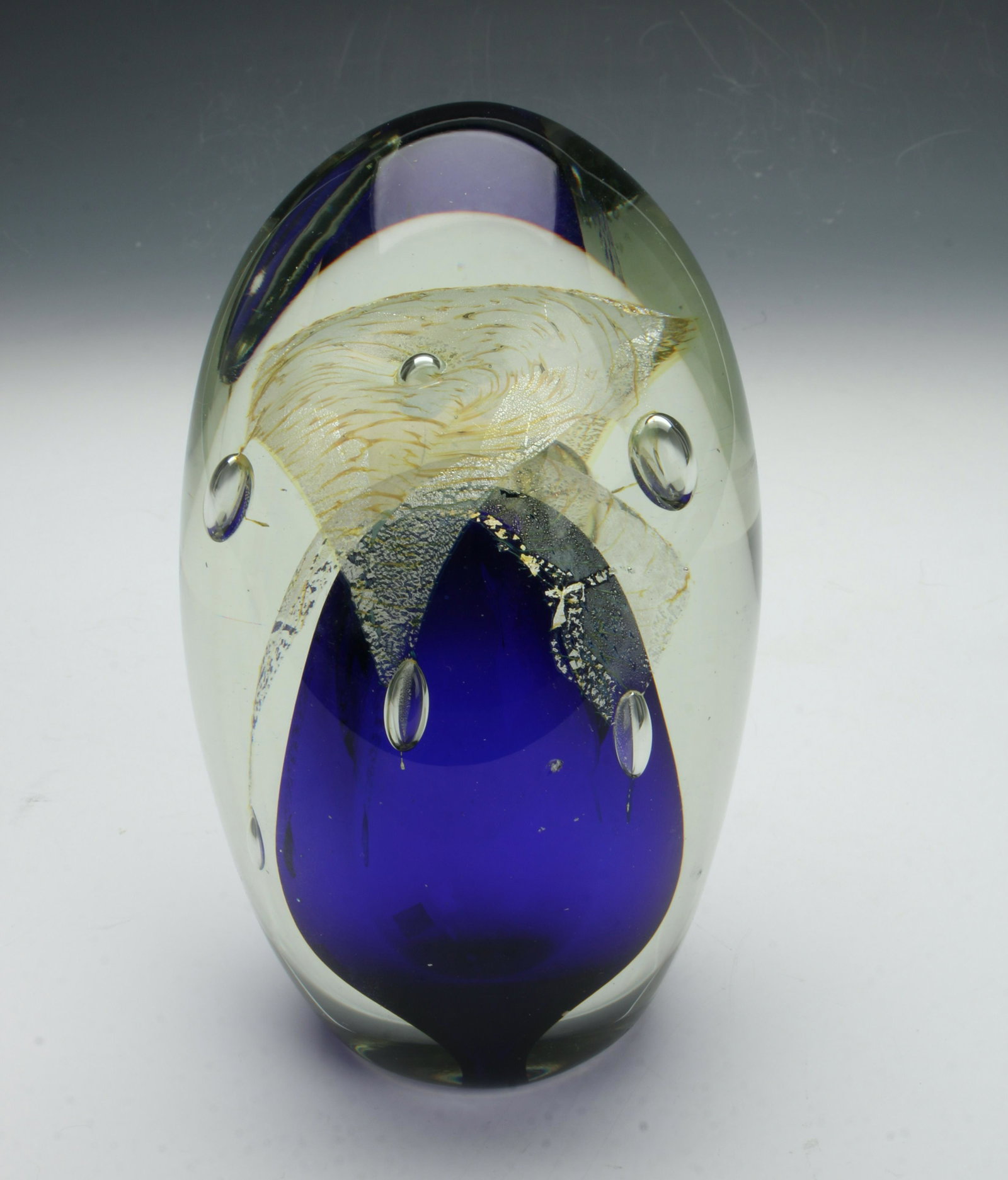 DRAMATIC JERUSALEM ART GLASS PAPERWEIGHT: Dramatic and impressive art glass paperweight with cobalt at the bottom and veiled with layers of gold and silver foils and accented with controlled bubbles. Signed and numbered Jerusalem 31/60. 3 1/2