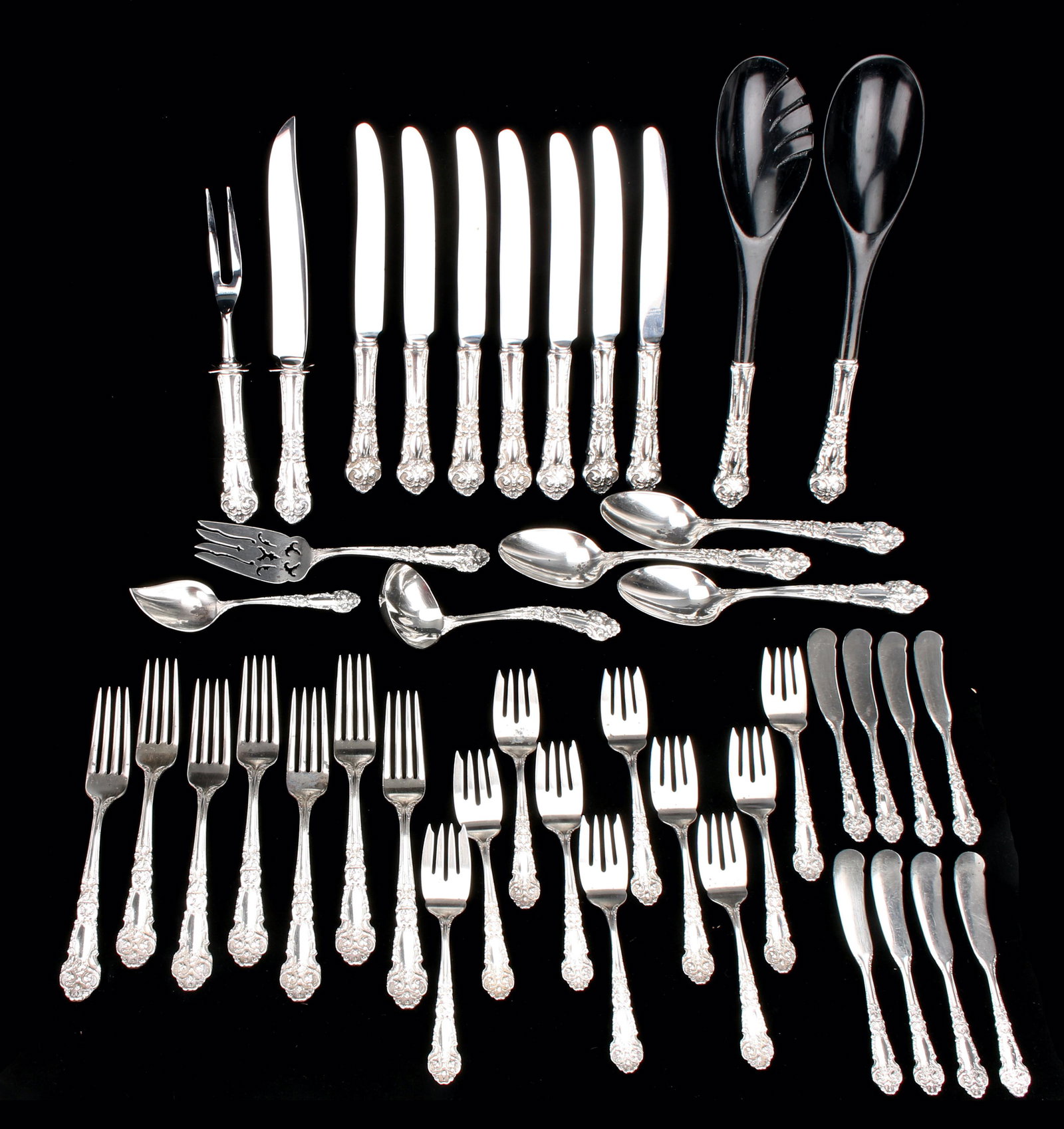 REED & BARTON STERLING SERVICE FOR 8 & UTENSILS: Seven dinner knives, carving fork and knife, ten teaspoons, eight butter knives, seven dinner forks, eight bouillon spoons, ten salad/dessert forks, four serving spoons, a pierced serving fork, ladle,
