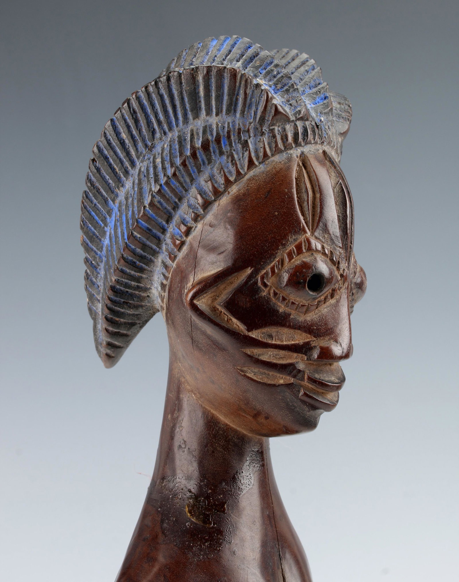 NIGERIAN YUROBA FIGURE: Female nude figure wearing platform sandals. Incised blue hair. Incised geometric patterns on cheeks, forehead and eyes. 3" X 10" $100 - $200 Please contact us for high resolution ima