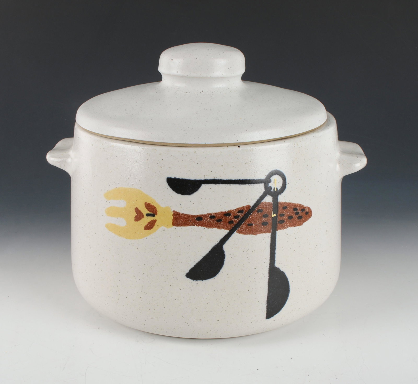 VINTAGE 1960S WESTBEND BEAN POT: This heavy stoneware pot is perfect size for stews, casseroles and of course beans. And features greta retro fork and measuring spoons graphic. Manufactured by West Bend in the 1960s, it is in excelle