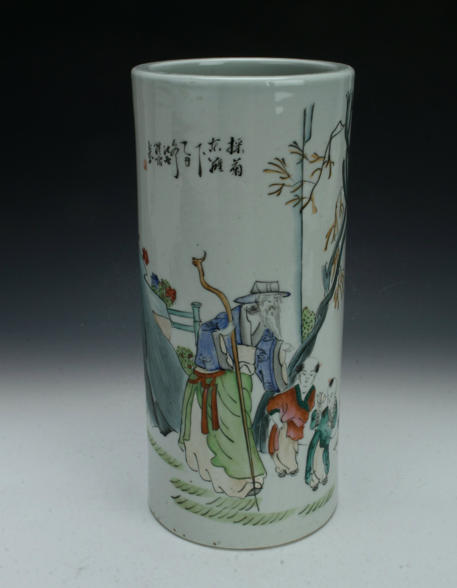 TALL CYLINDRICAL ELDER VASE: An elder holds a staff while guiding two children in a garden. A large boulder, tree, and flowers decorate the garden. Calligraphy and artist mark on top. 4 3/4" X 10 1/2" $40 - $80 P