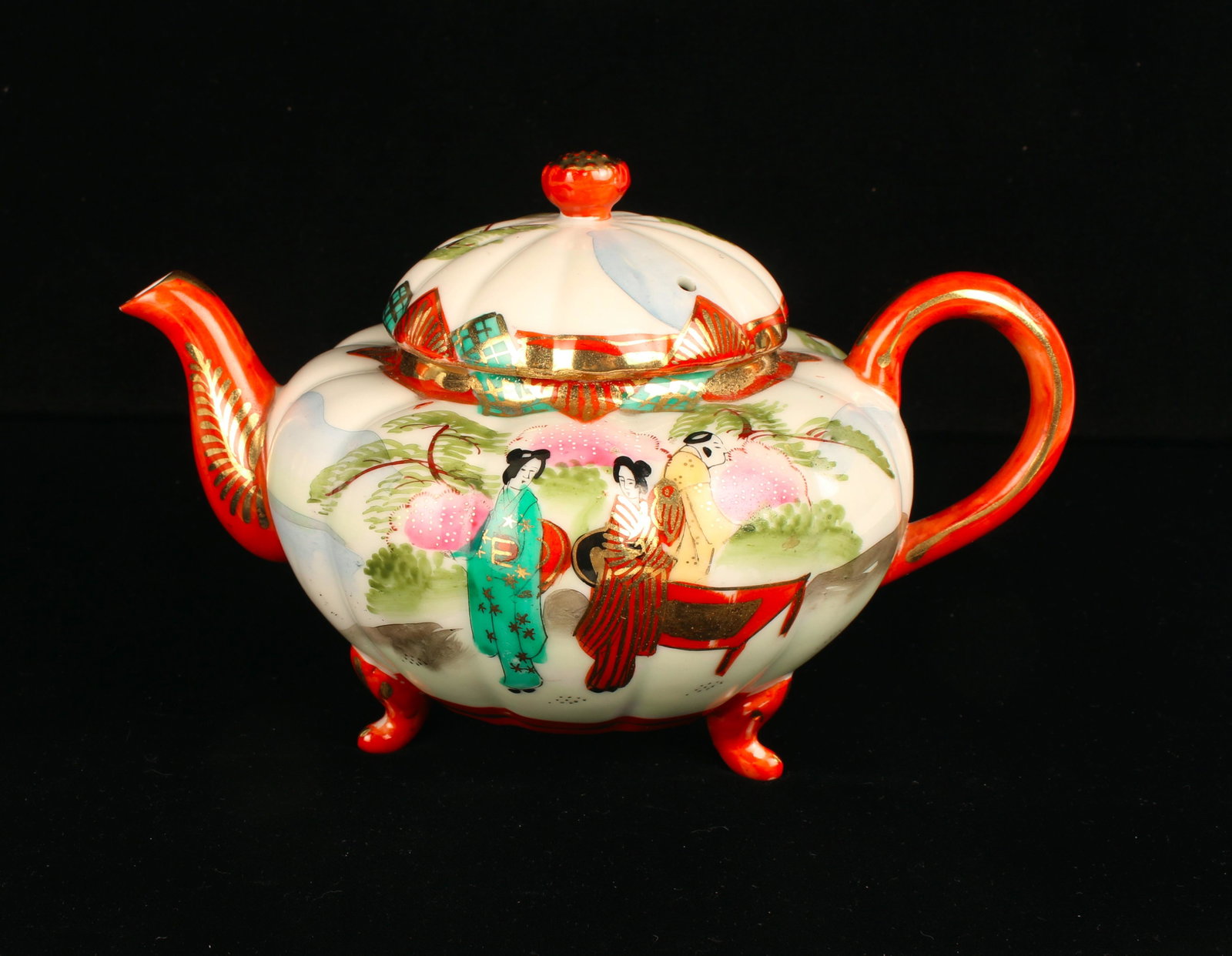 JAPAN NIPPON PORCELAIN HAND PAINTED TEA POT: In gourd form with beauties in a garden scene. Accented in gold on tripod feet. Marked made in Japan TT. 9" X 5" $40 - $80 Please contact us for high resolution images of this lot.