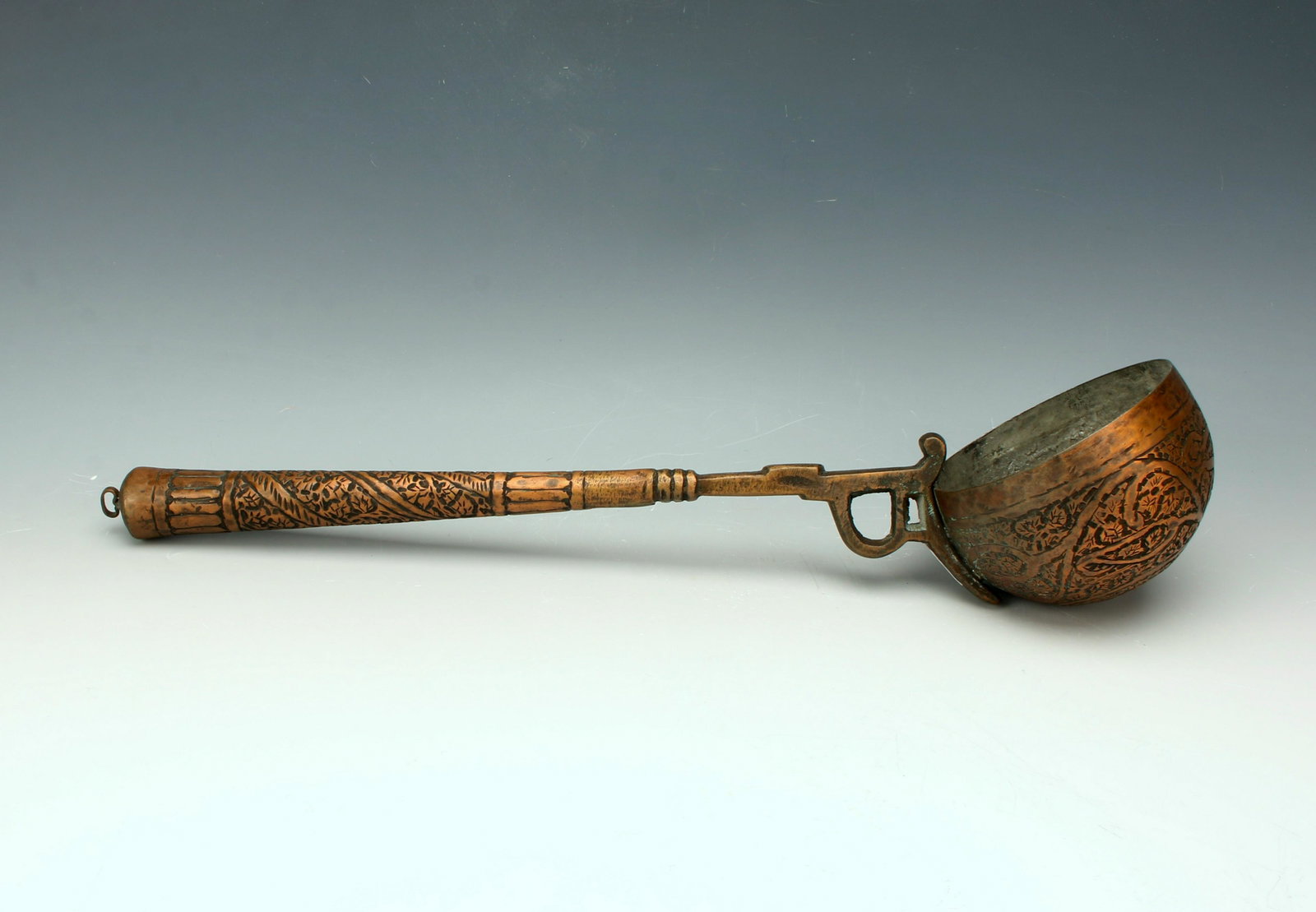 19TH CENTURY KASHMIRI COPPER LADLE: Designed with vines and tendrils. Ladle bowl lined for use. 15 1/2" X 4" $40 - $80 Please contact us for high resolution images of this lot. Shipping: We