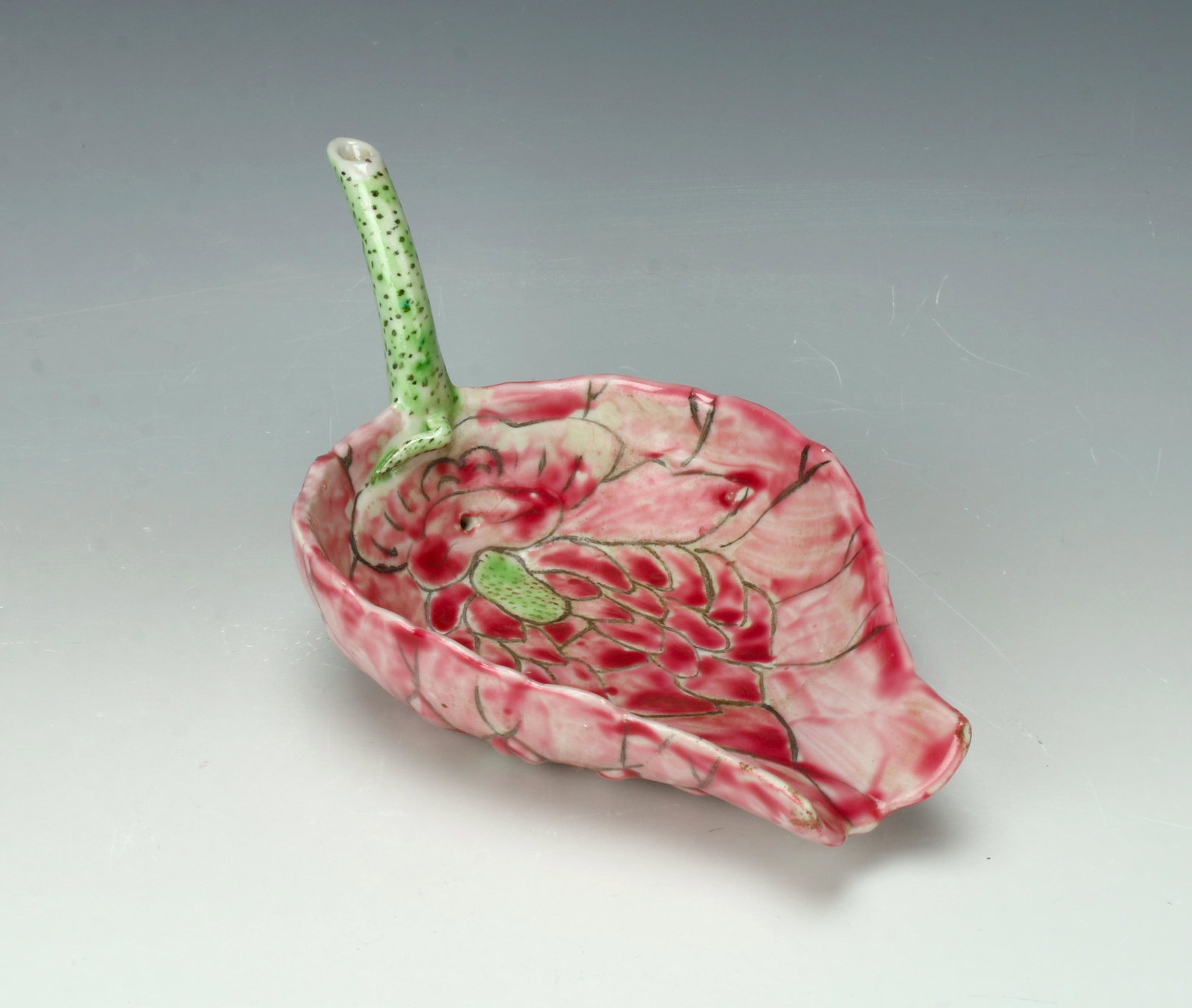 LOTUS BLOSSOM BRUSH WASHER: Shades of pink with a green stem, the back of the stem is filled with calligraphy. Provenance: private collection.