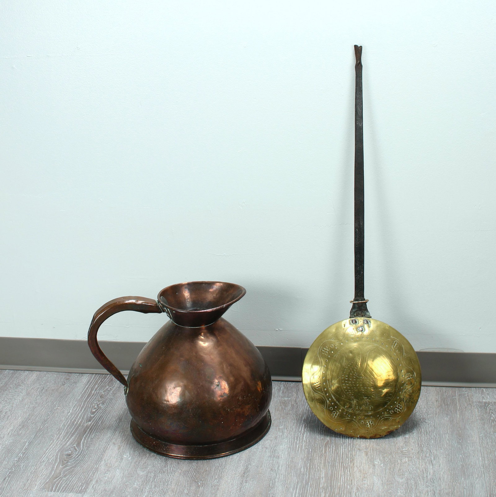HAND FORGED BED WARMER & LARGE COPPER EWER: Bed warmer has pierced decorations and an incised eagle design on the brass lid. 40" X 13" $40 - $80 Please contact us for high resolution images of this lot. Shipping: