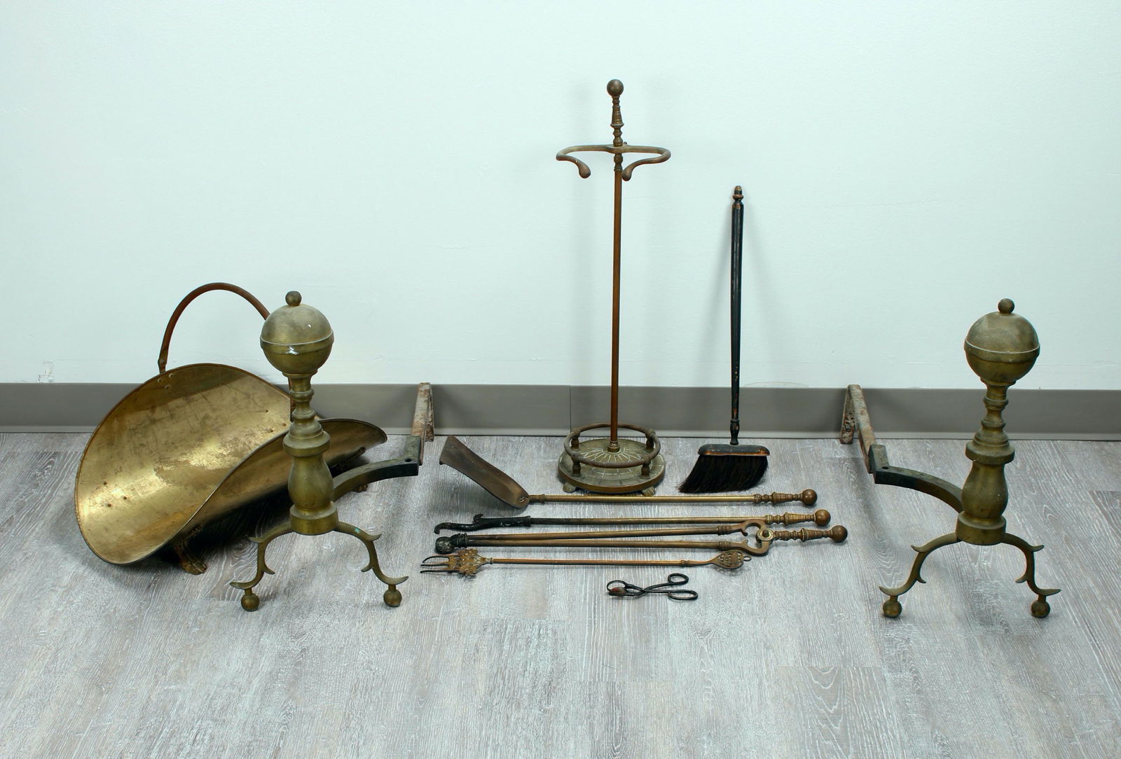 ANTIQUE FIREPLACE TOOLS & ACCESSORIES: Pair of large round finial andirons. Tools include shovel, poker, tongs, fork, and candle scissors. Stand marked BPS with paw feet and sundial base. Brass kindling basket with paw feet. $40 - $80 Ple