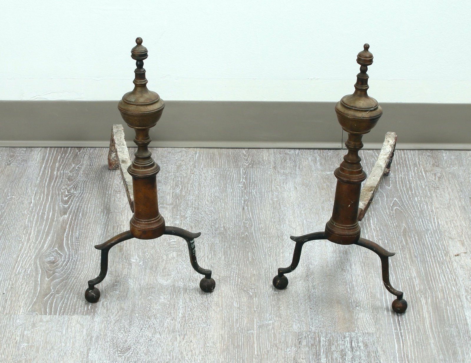 PAIR ANTIQUE ANDIRONS: Urn form finial and ball feet. 17" X 18" $40 - $80 Please contact us for high resolution images of this lot. Shipping: We are unable to ship this item. P