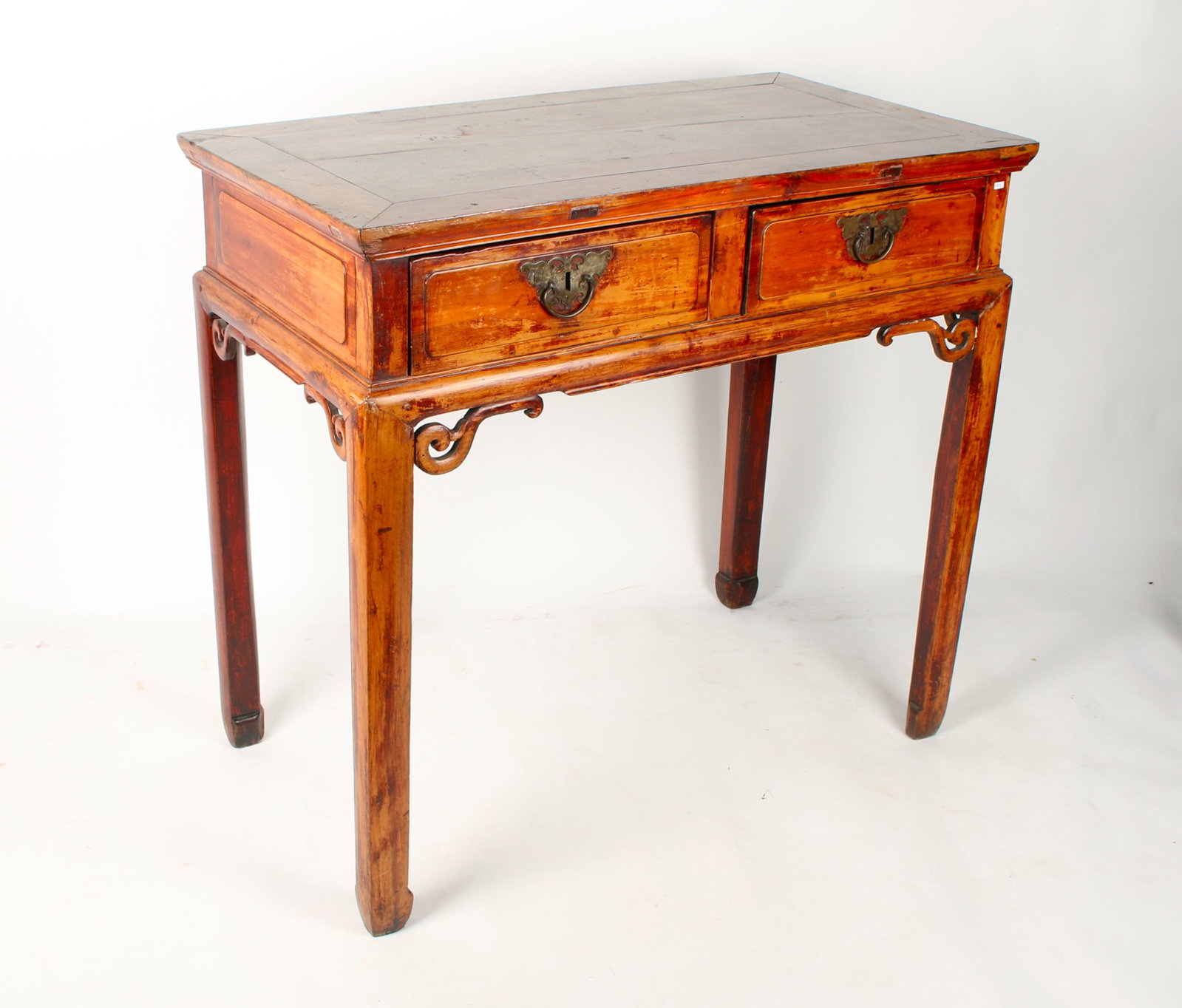 TALL WOODEN HALL TABLE: Curvilinear brackets, butterfly hardware on the drawers, and hoof feet. 38 1/2" X 21 1/2" X 36" $40 - $80 Please contact us for high resolution images of this lot. Shippin