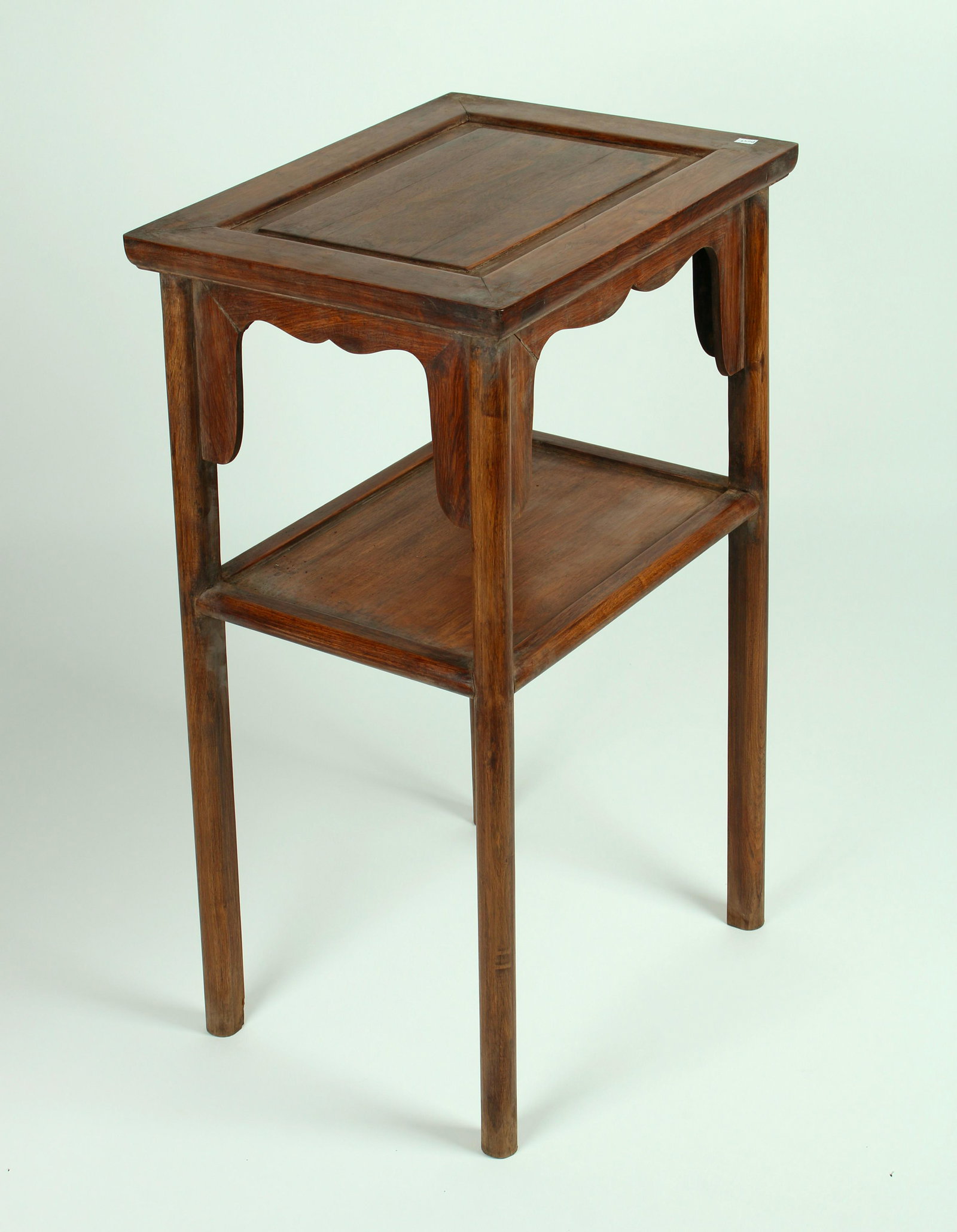HUANGHUALI TWO TIERED END TABLE: Two tiered end table with curved apron. 18" X 30" $300 - $500 Please contact us for high resolution images of this lot. Shipping: We are able to pack and