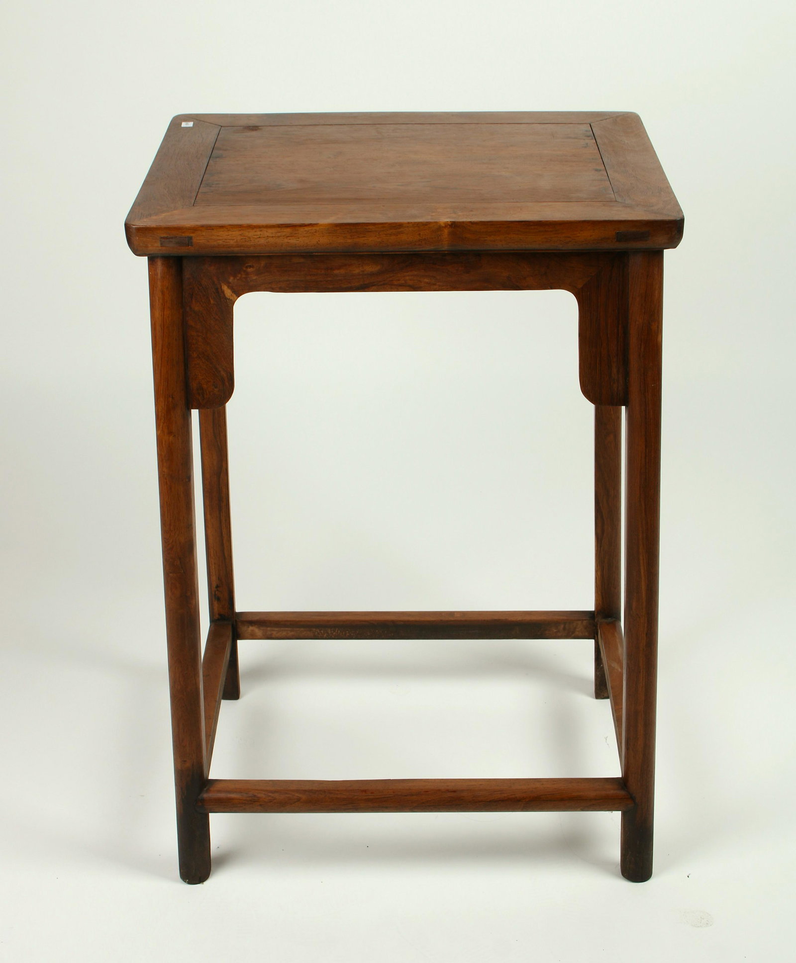 HUANGHUALI END TABLE: With curved apron that has flanges, and stretchers at the bottom. 19" X 27 1/2" $300 - $500 Please contact us for high resolution images of this lot. Shipping: