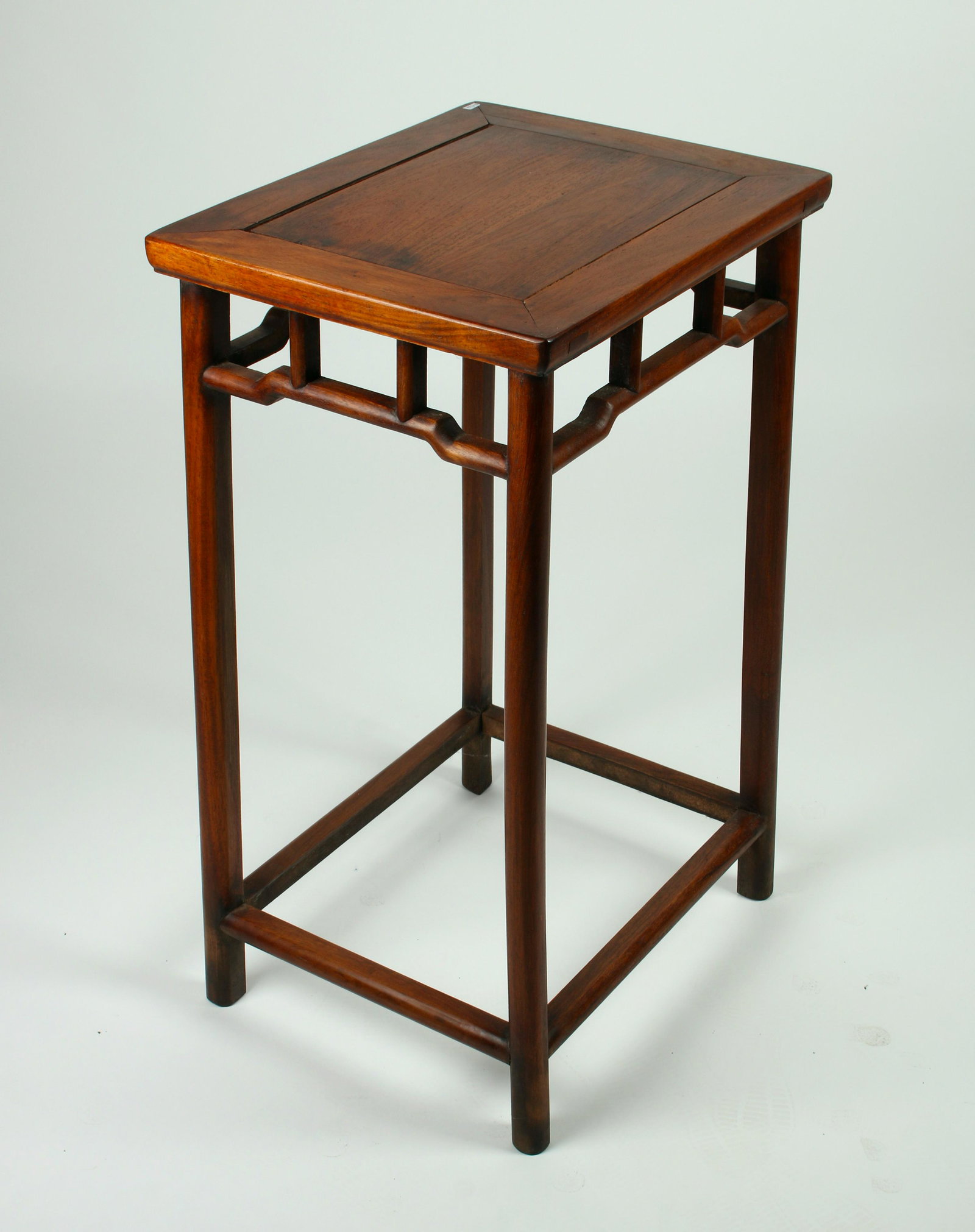 HUANGHUALI END TABLE: Floating panel top with open work curved apron. 17" X 13 3/4" X 28 1/2" $300 - $500 Please contact us for high resolution images of this lot. Shipping: