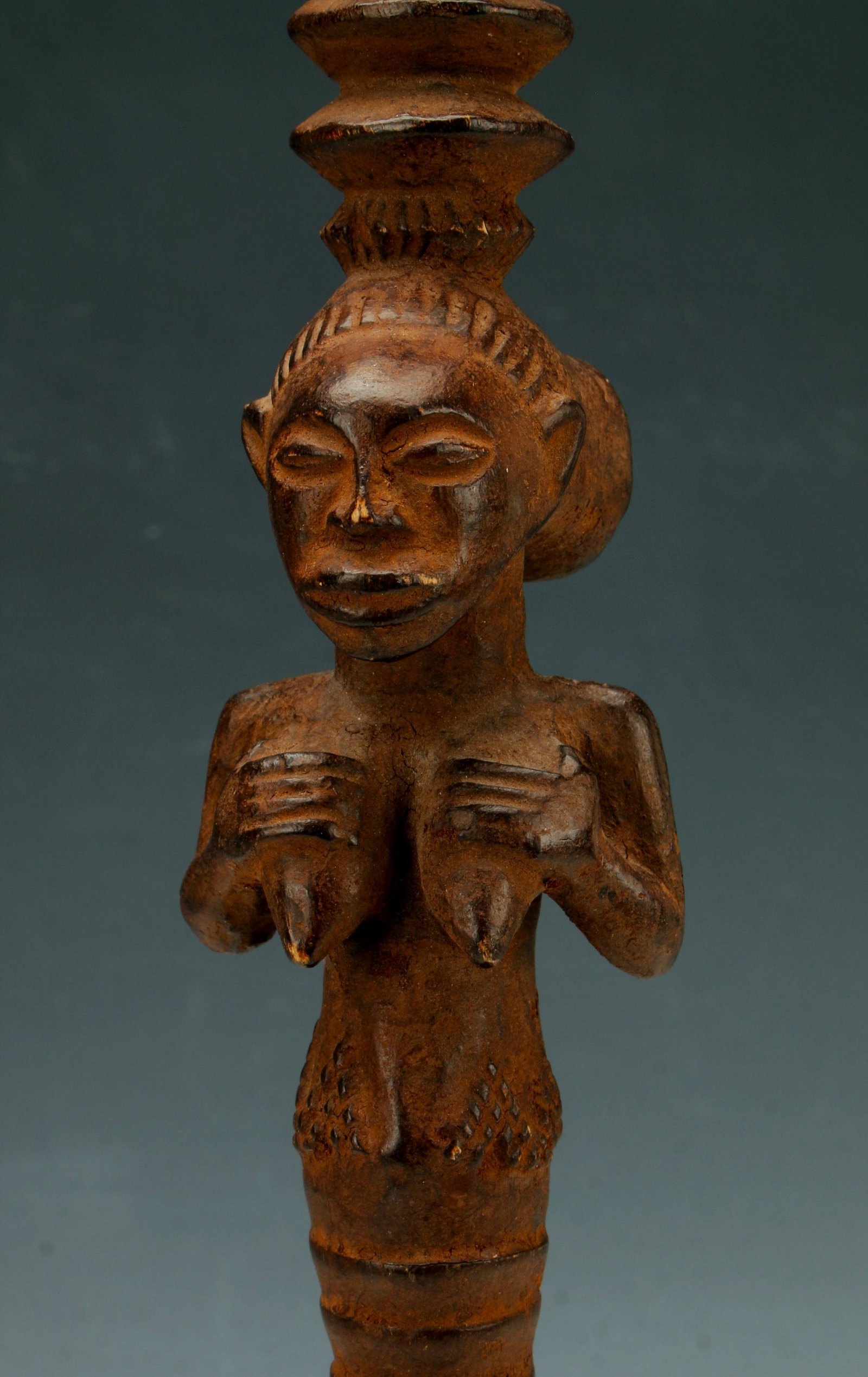 AFRICAN FERTILITY FEMALE CARVED CEREMONIAL TOTEM: Carved and incised with diapered pattern above the female form with a carved bust of a female is in the center. Ends in a point. With stand. Provenance: From Al