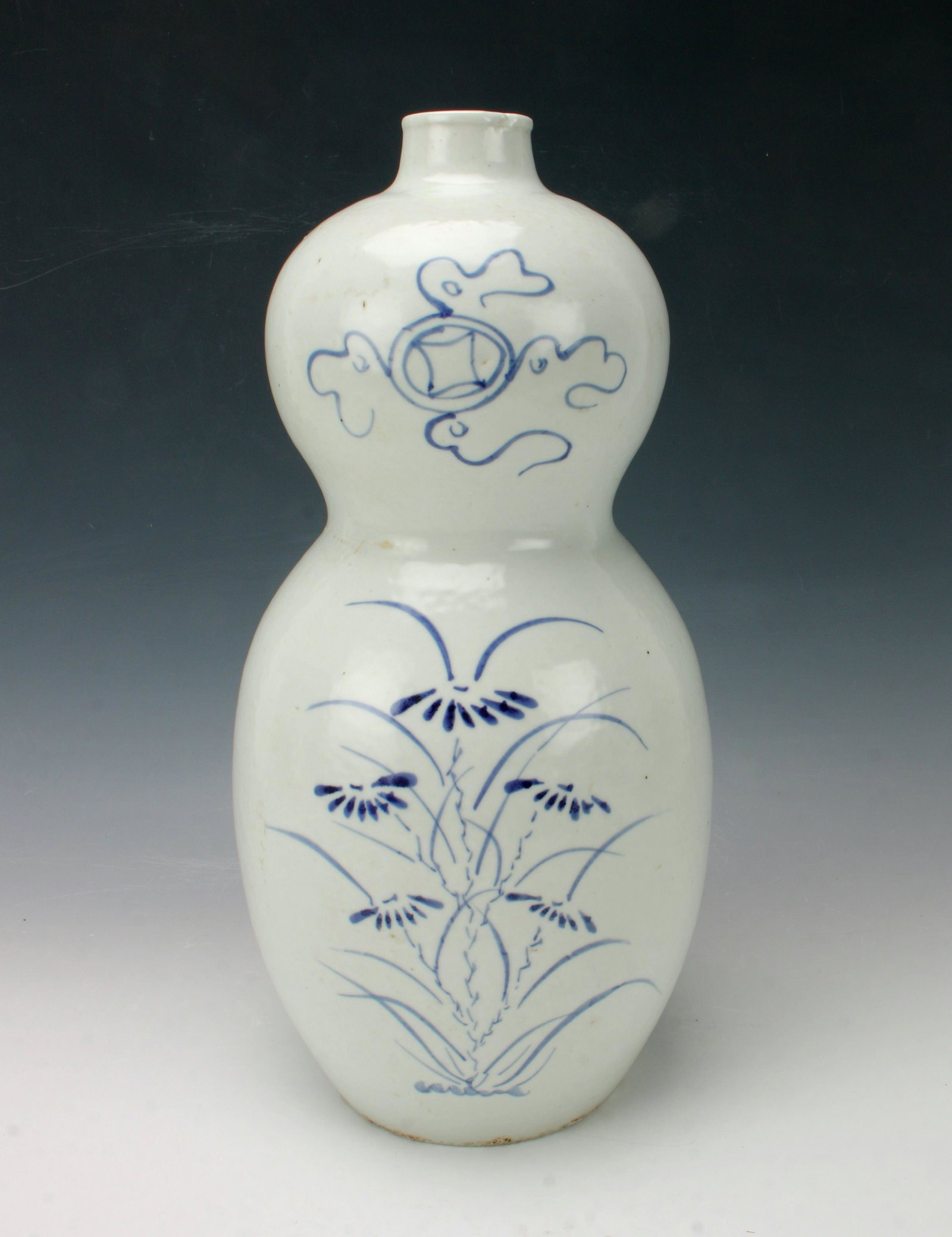 KOREAN DOUBLE GOURD VASE: Decorated with line drawings of flying lucky coin and garden flowers. Provenance: private collection. 14" x