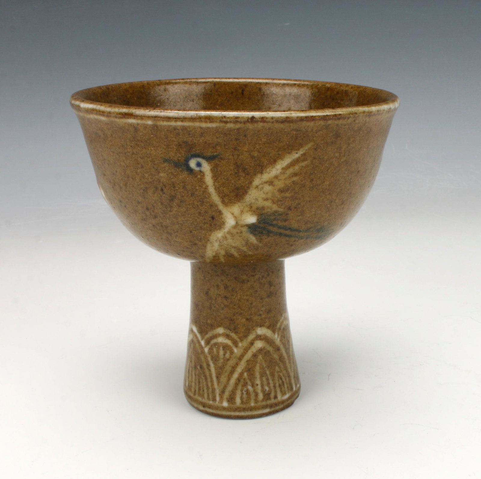 KOREAN HIGH HEELED CRANE CUP: Lotus petal border on the foot. Cranes on the body with abstract cloud patterns. Provenance: private collection.