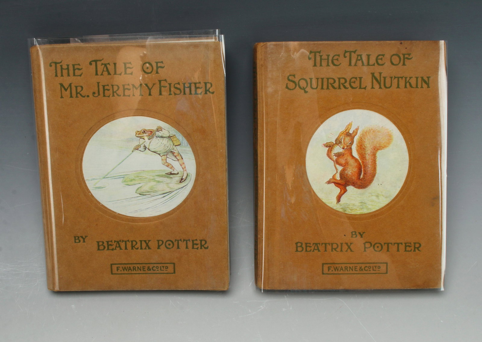 TWO BEATRIX POTTER BOOKS 1903 1906 WARNE: The Tale of Squirrel Nutkin and The Tale of Mr. Jeremy Fisher. Copywrite 1903, 1906, Frederick Warne, London and New York. 4 1/2" X 5 1/2" $200 - $400 Please contact us for high resolu