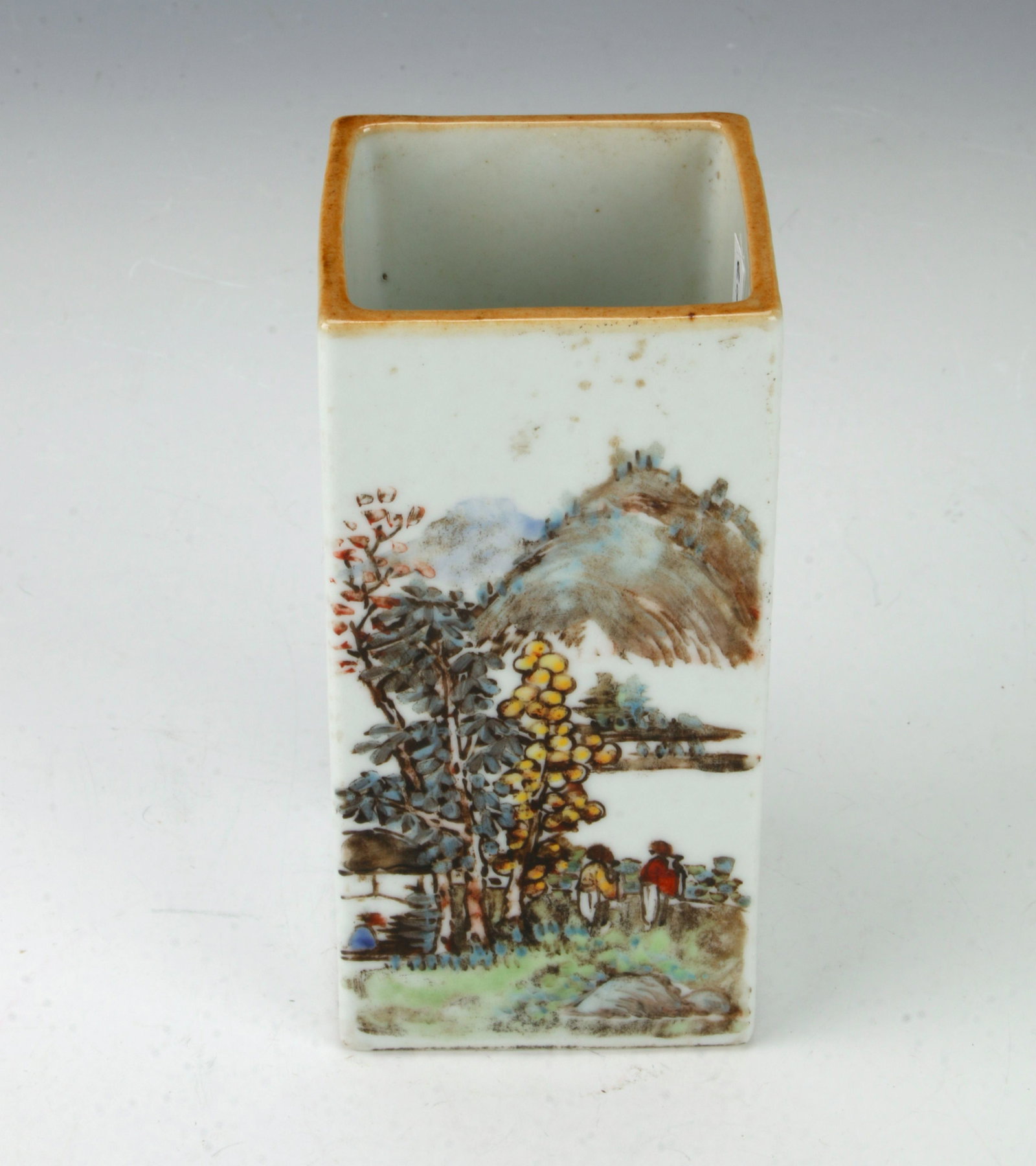 SMALL RECTANGULAR PORCELAIN LANDSCAPE BRUSH POT: The sides alternate between village scenes and calligraphy. Marked on the bottom. 2" X 3 3/4" $300 - $500 Please contact us for high resolution images of this lot. Shipping:</