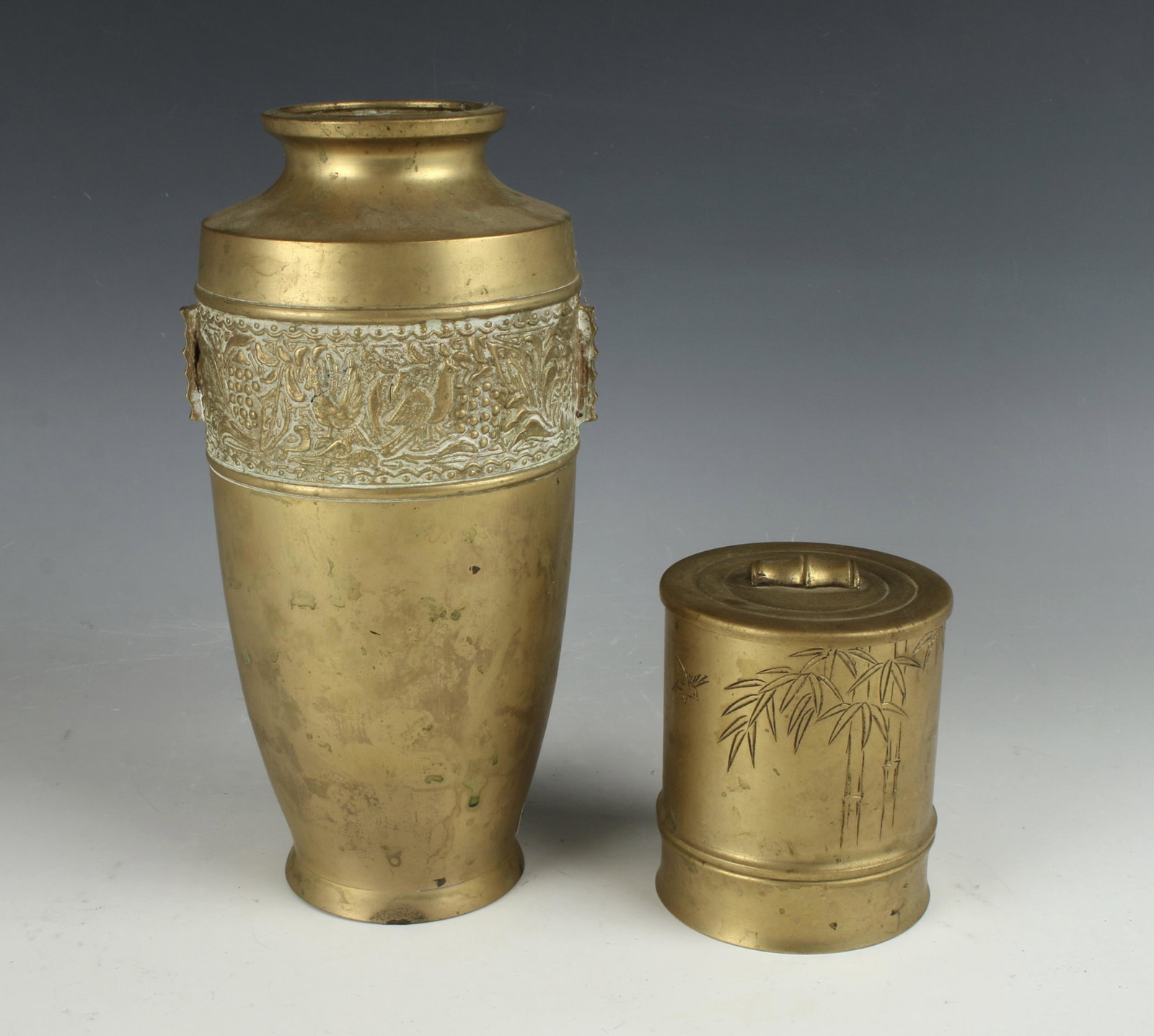2 MIDDLE EASTERN BRASS CANISTERS: One urn shape vase and a covered jar decorated with bamboo. 5 1/2" X 8 1/2" $40 - $80 Please contact us for high resolution images of this lot. Shipping: