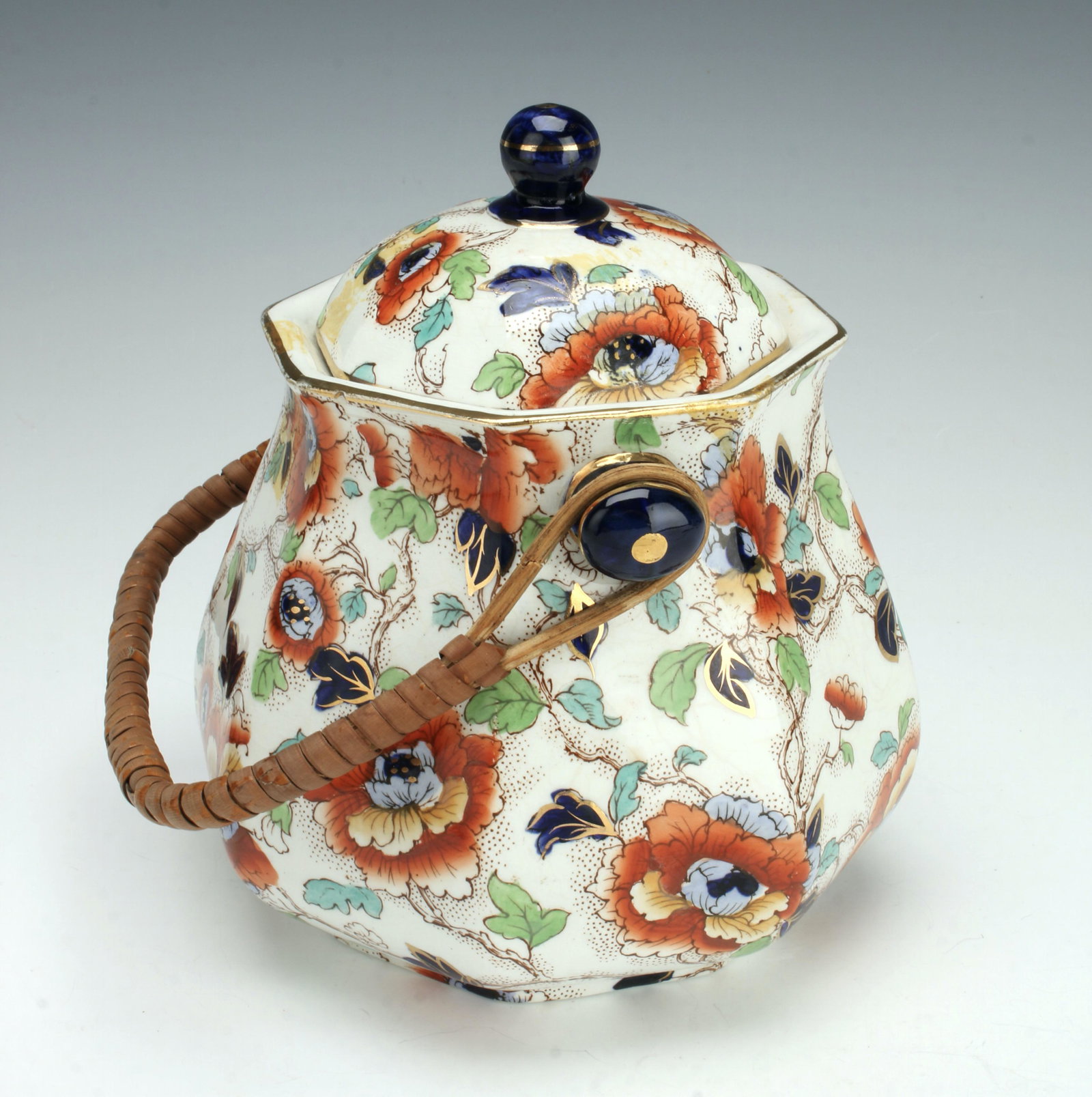 LOSOL WARE KEELING ENGLISH LIDDED BISCUIT JAR: Antique Losol Ware Denman biscuit jar marked Keeling & Co, Ltd., Burslem England. Flow Blue transfer ware with multicolor painting and gold decoration. With rattan handle. 6" X 7" $40