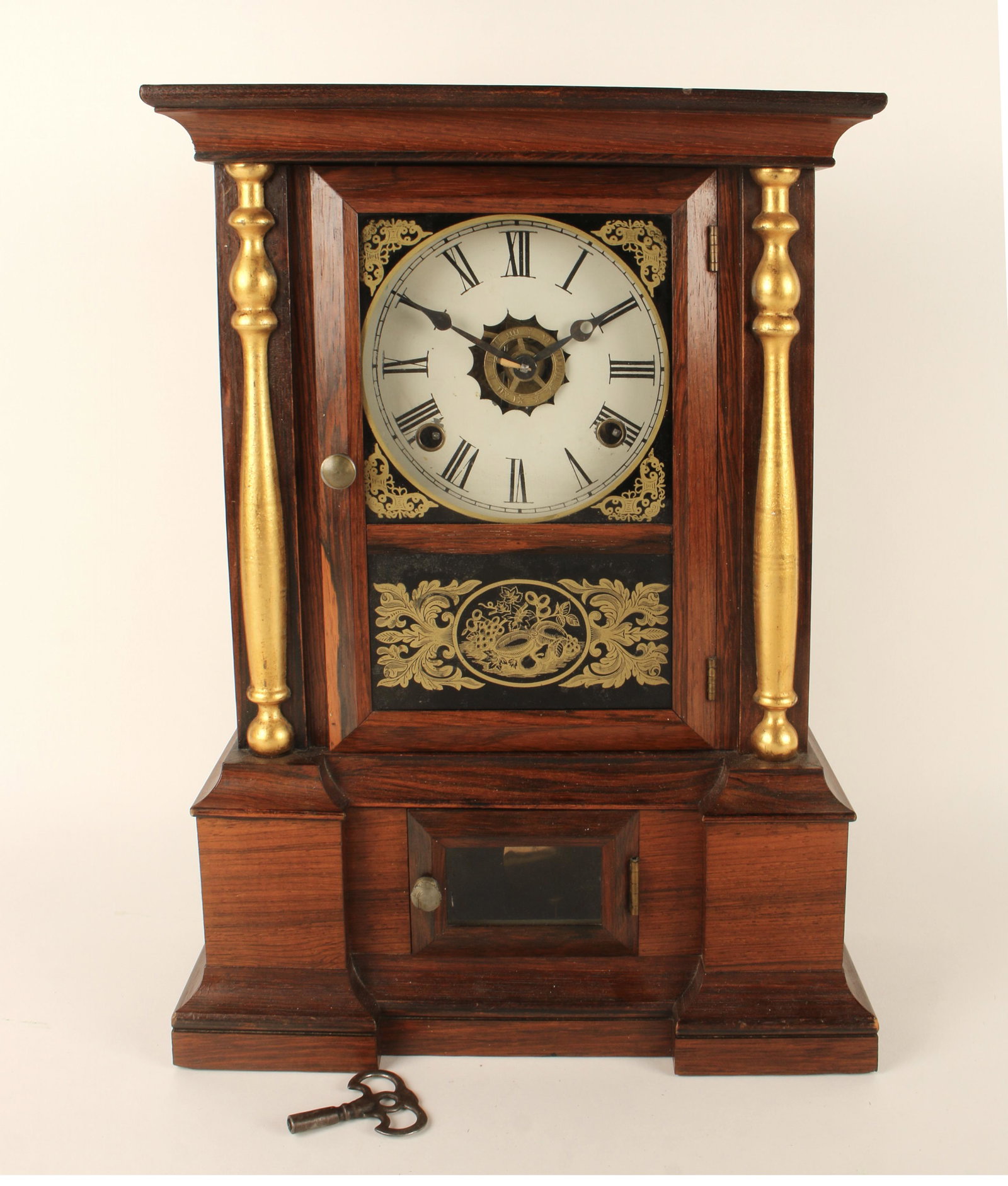 ATKINS SHELF CLOCK: Bristol, CT. With Alarm mechanism. With gold columns and gold stenciled reverse painting on door. 19th century. 16 1/2" x 11 1/2" x 4 1/2" $200 - $400 Please contact us for high r