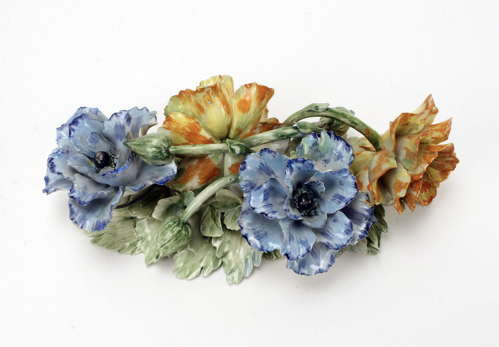 ITALIAN CAPODIMONTE FLORAL WALL ARRANGEMENT: Blue and yellow blooming flowers and green foliage intertwine. Marked with an "N" and crown on the bottom. This arrangement was designed as a centerpiece, but was been wired to have a wall o