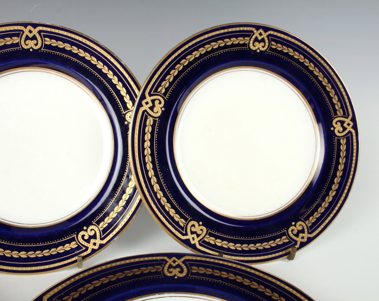 GEORGE JONES ENGLAND DESSERT SALAD PLATES: Six George Jones & Sons Crescent blue & gold porcelain plates. With striking gold pattern on cobalt blue wide border. 7" $100 - $200 Please contact us for high resolution images of