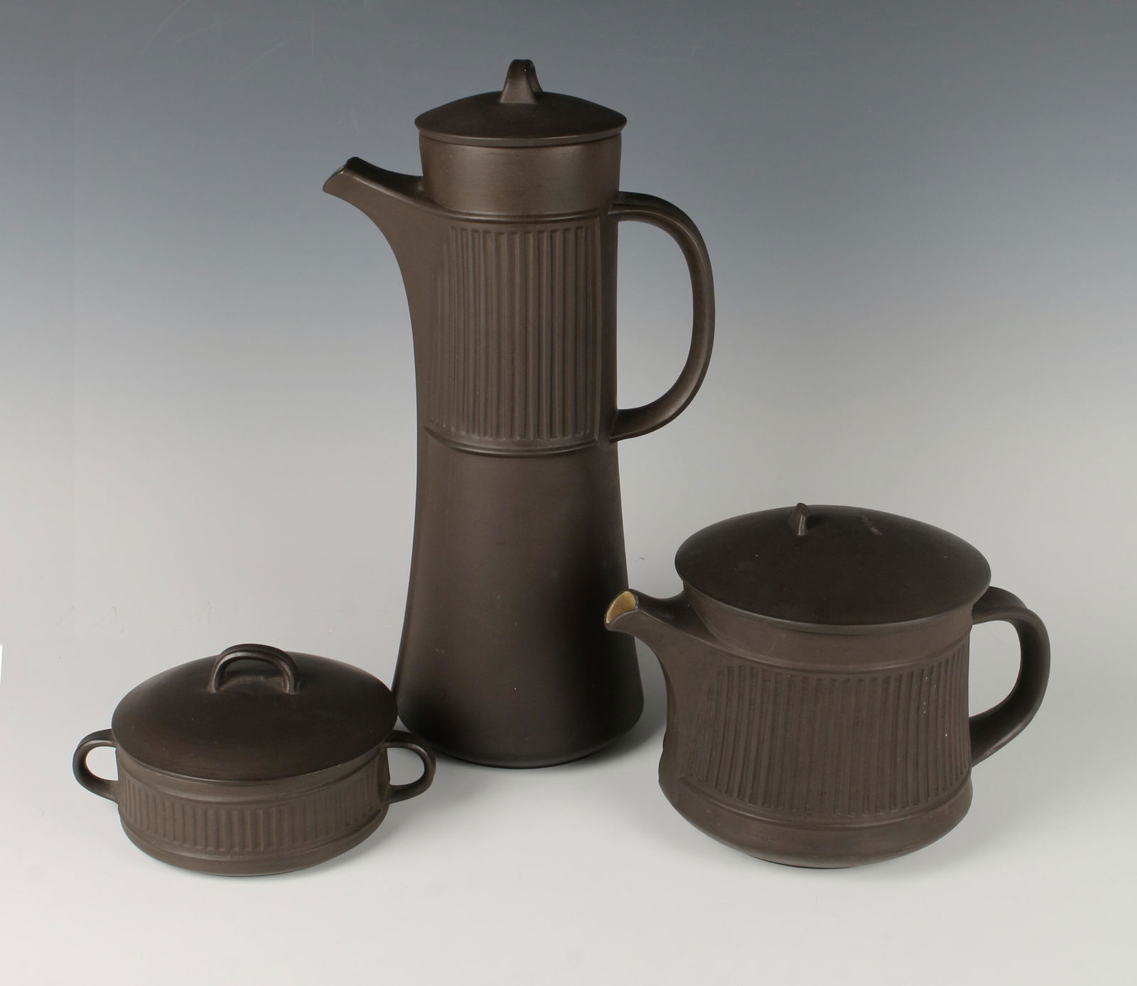 DANSK FLAMESTONE COFFEE SUGAR TEA QUISTGAARD: MCM brown Flamestone coffee pot with four duck mark on bottom, tea pot with three duck mark and covered sugar bowl with a four duck mark by Jens H. Quistgaard for Dansk designs, circa 1958-1964. W