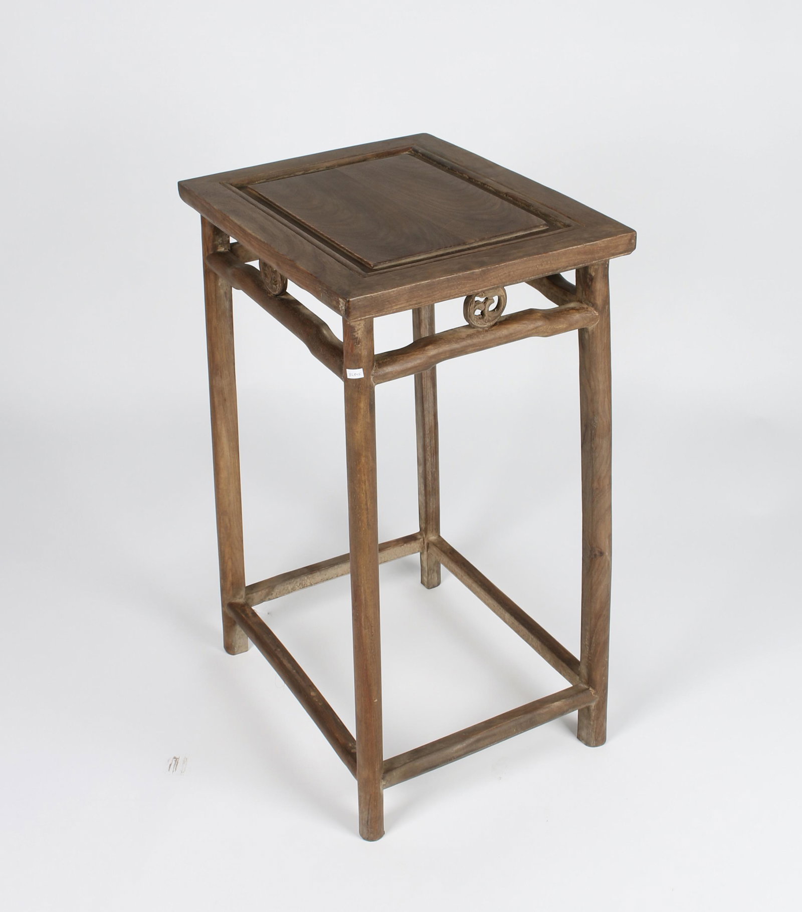 HUANGHUALI END TABLE: Floating panel top. The top and the first rung are joined by pierced circular dragon medallions. 17" X 13" X 26" $200 - $400 Please contact us for high resolution images of this