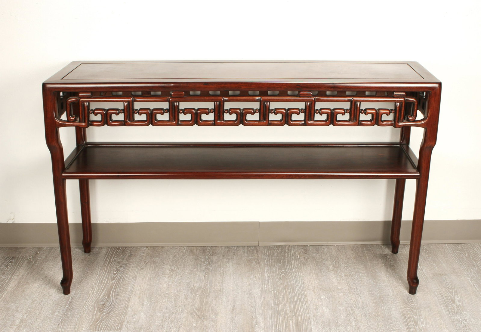 CARVED CHINESE STYLE SOFA TABLE: Has a shelf and floating panel top. Carved on both sides. 50" x 30" x 14" $100 - $200 Please contact us for high resolution images of this lot. Shipping: