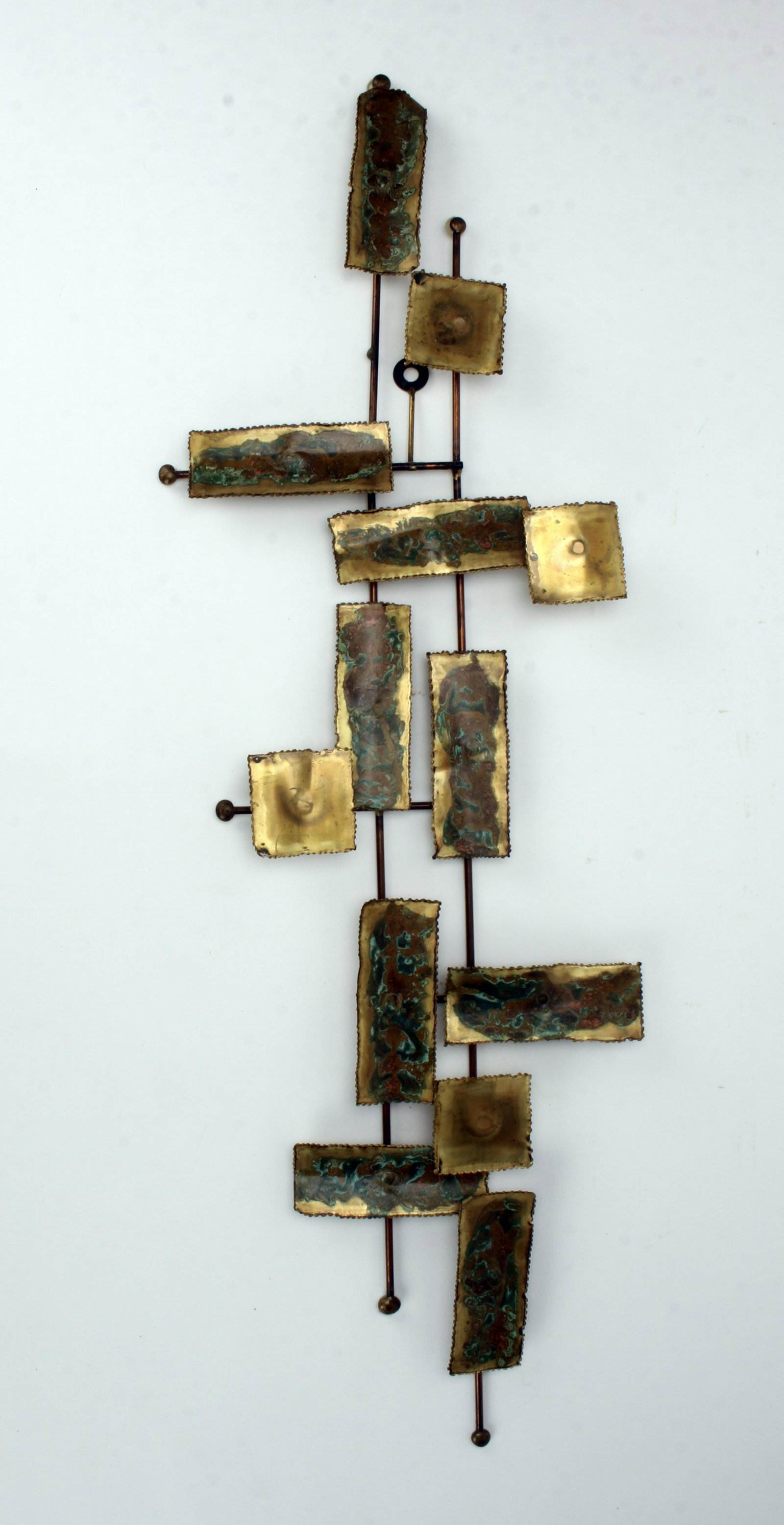 VINTAGE MCM BRUTALIST JERE STYLE WALL SCULPTURE: With hanger to hand vertically but could easily be hung horizontally. 34" x 11" $40 - $80 Please contact us for high resolution images of this lot. Shipping: