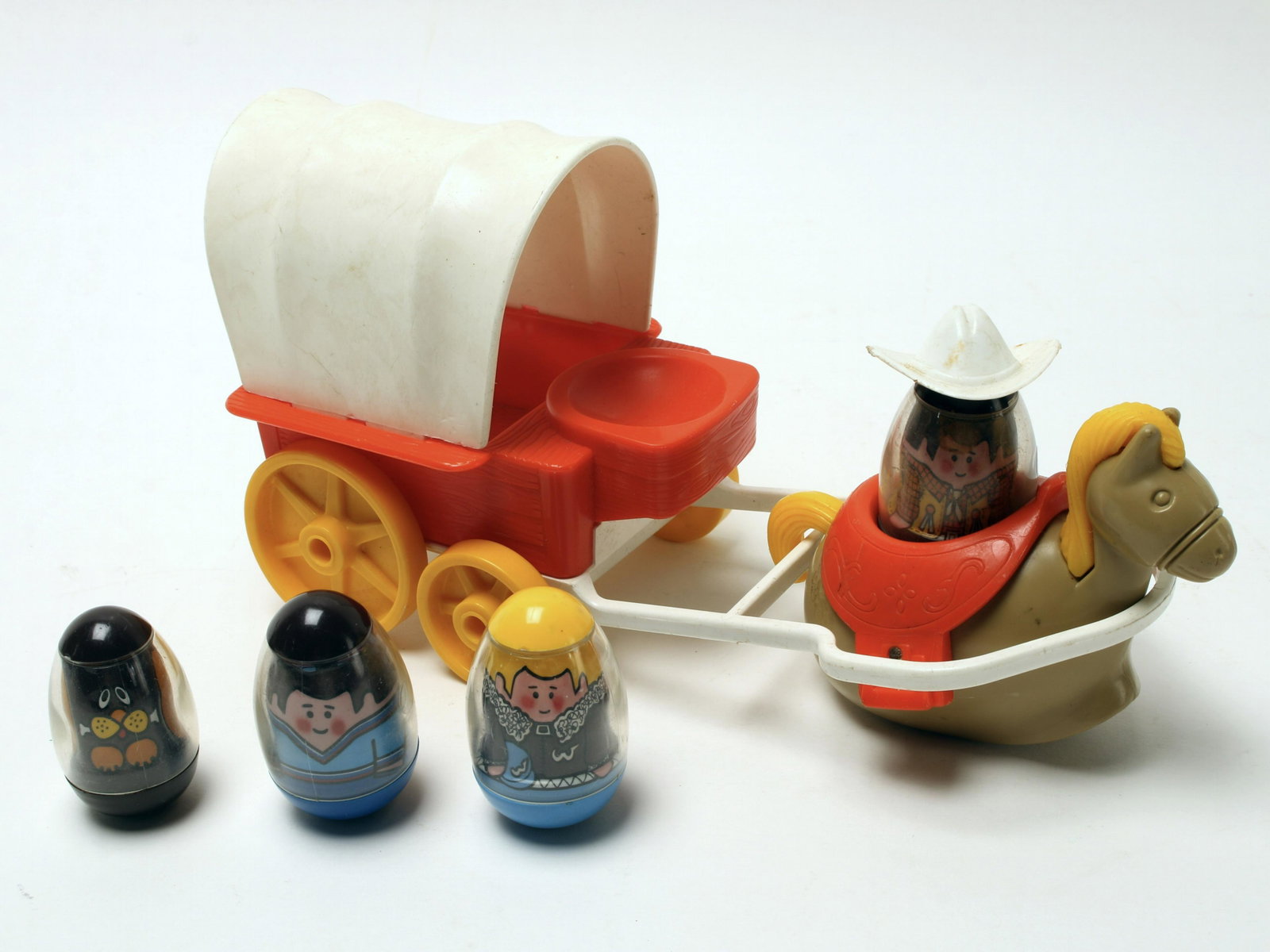 1974 WEEBLES WAGON MASTER & EXTRA WEEBLES: 1974 Weebles Wagon Master with wagon, cover, horse, cowboy, and hat. Three extra Weebles are included. 4 1/2" X 3 1/2" $30 - $60 Please contact us for high resolution images of this l