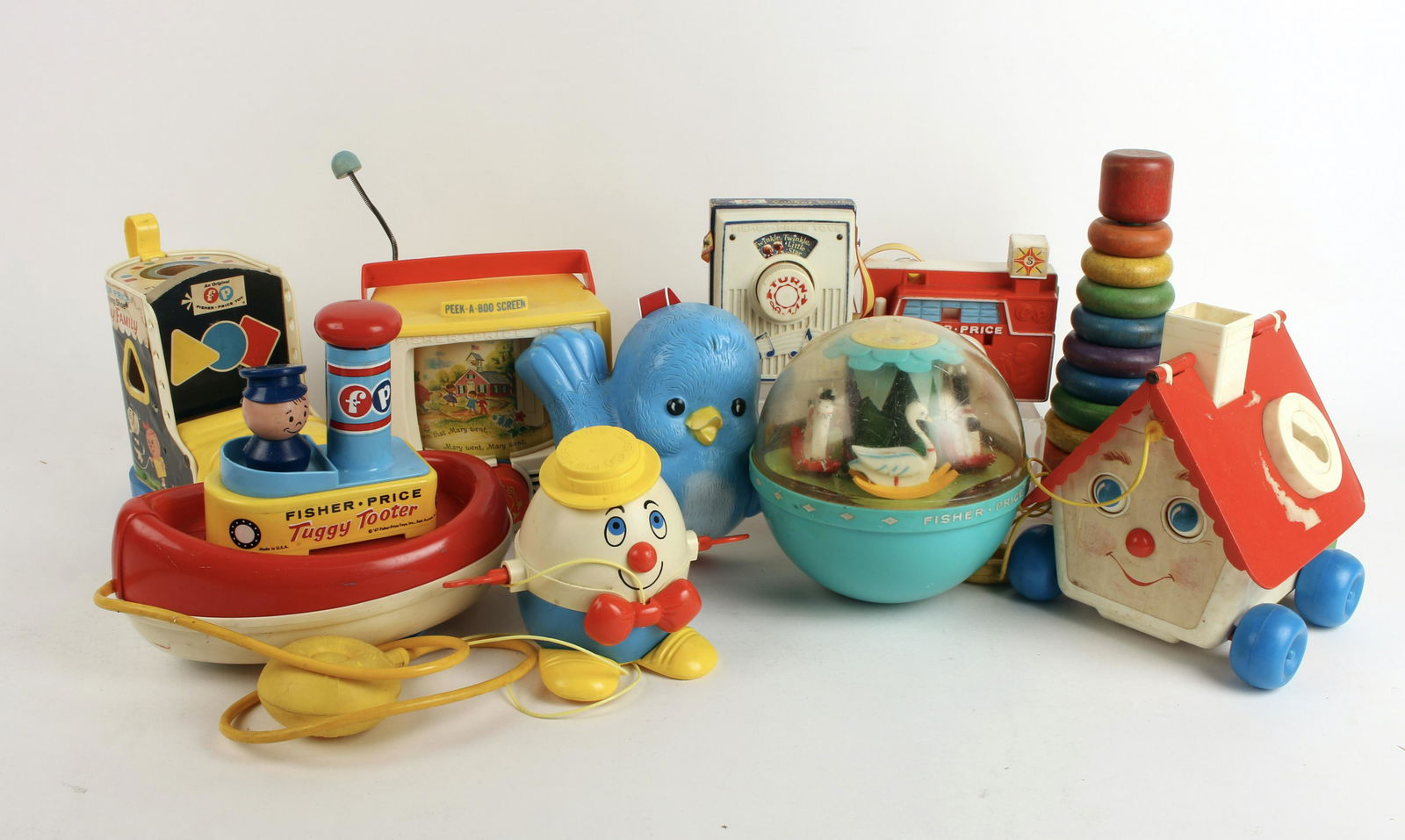 ASSORTED LOT VINTAGE FISHER PRICE TOYS/PLAY SKOOL: Included is Humpty Dumpty pull toy, wooden ring stacking toy, Goldie Locks & the Three Bears house, Roly Poly Chime Ball, Tuggy Tooter pull toy, Mary Had a Little Lamb Peek-a-boo screen, Lacing Sh