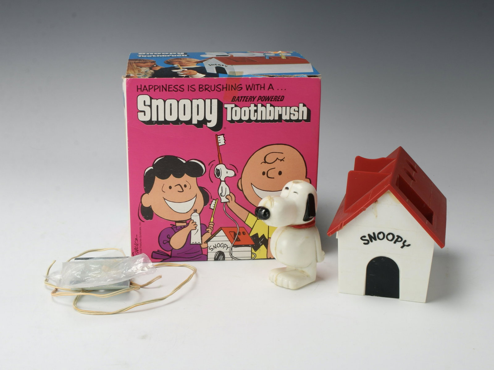 SNOOPY BATTERY POWERED TOOTHBRUSH IN BOX 1972: Bring home some nostalgia, even just for show. This set is not complete, but is sure to evoke memories of your childhood bedtime routine. 7" X 7" X 6" $100 - $200 Please contact
