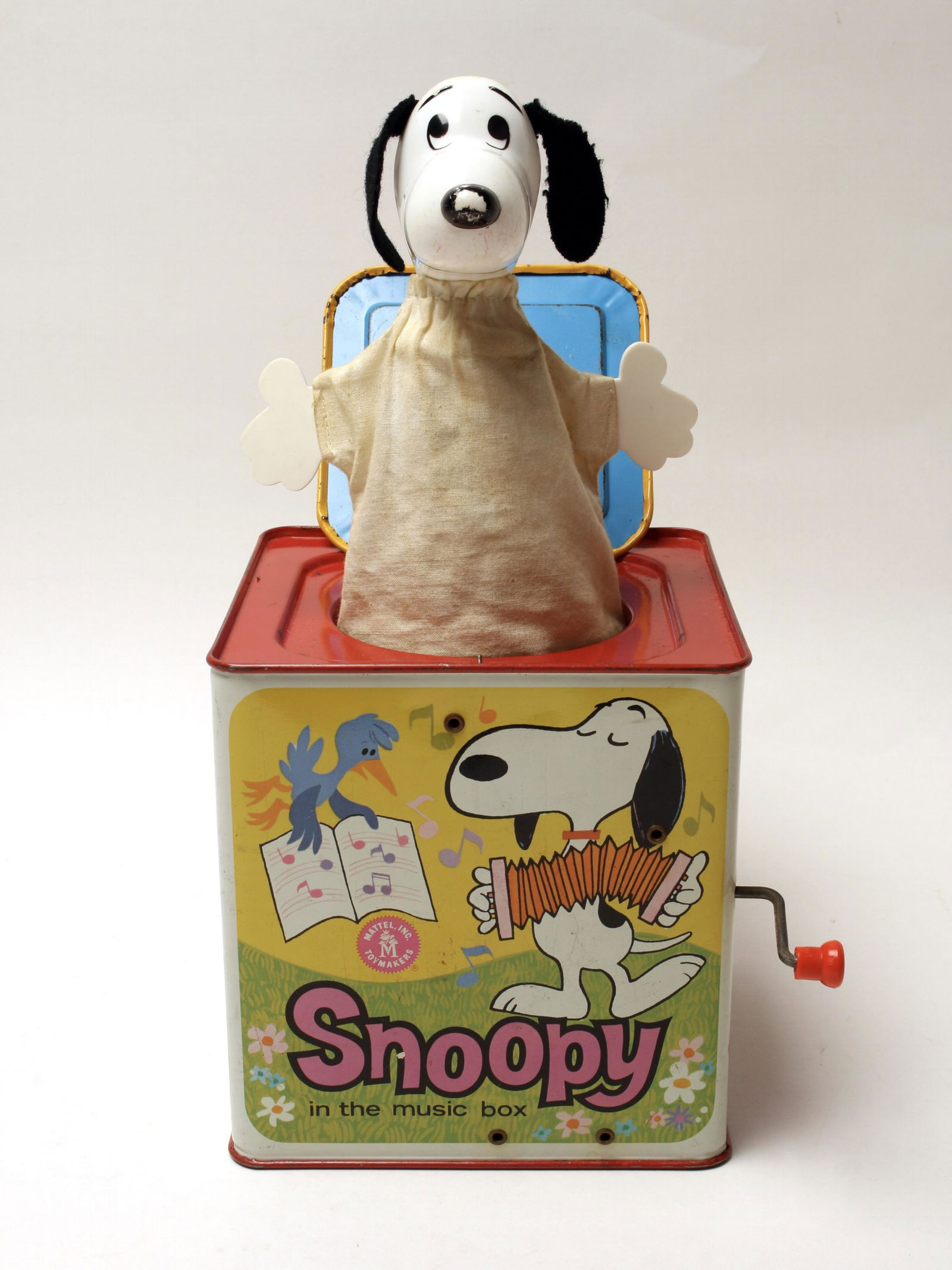 SNOOPY IN THE MUSIC JACK IN THE BOX MATTEL 1966: Plays music when crank is turned until Snoopy reveals himself. Each side has images of Peanuts characters. Dated 1966. 5 1/2" X 5 1/2" X 5 1/2" $100 - $200 Please contact us for h