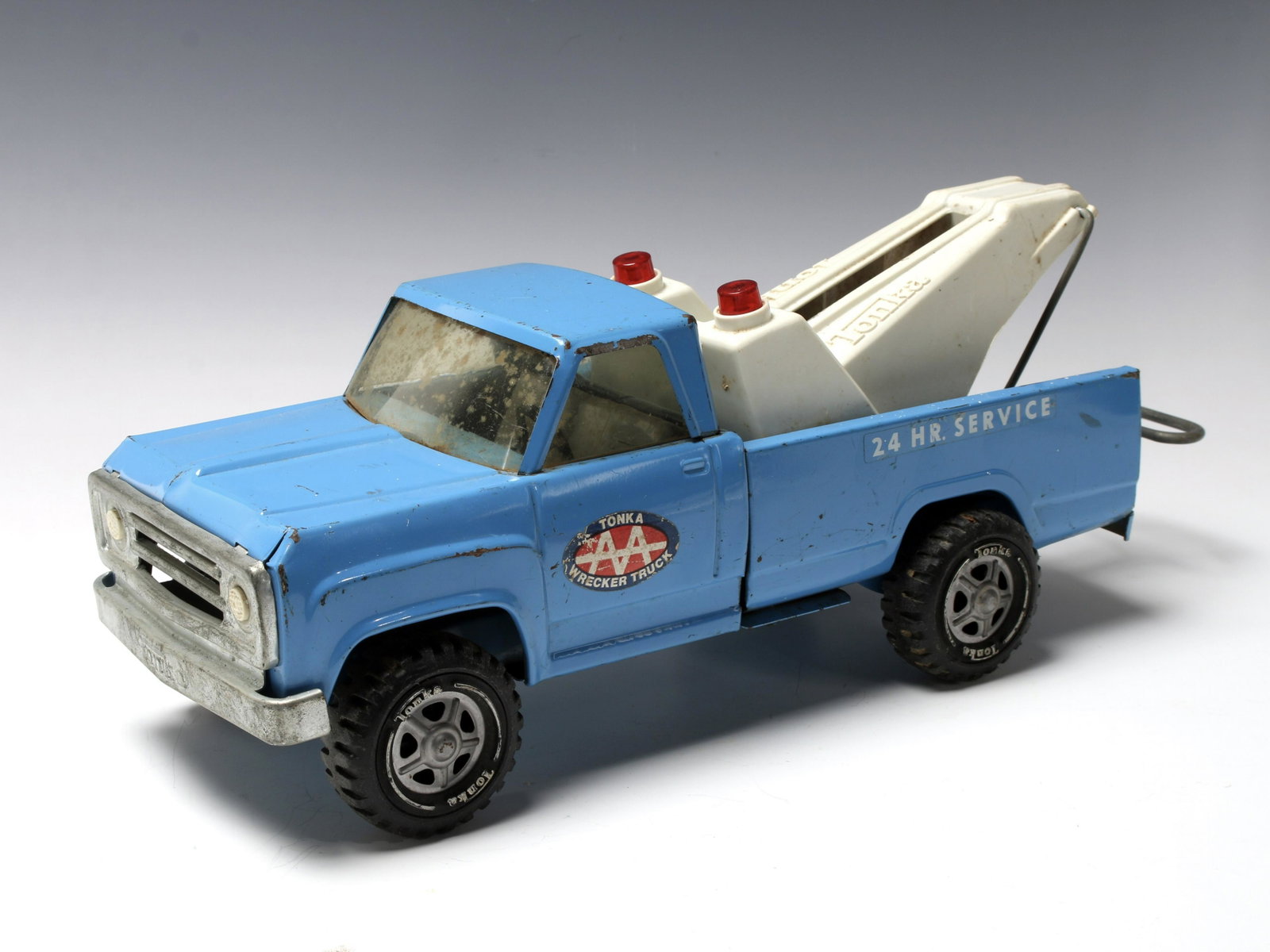 VINTAGE TONKA PRESSED STEEL WRECKER TRUCK: Vintage Tonka pressed steel wrecker truck. With decals on doors and 24 HR Service on back. 18" X 5" X 5 1/2" $40 - $80 Please contact us for high resolution images of this lot. <