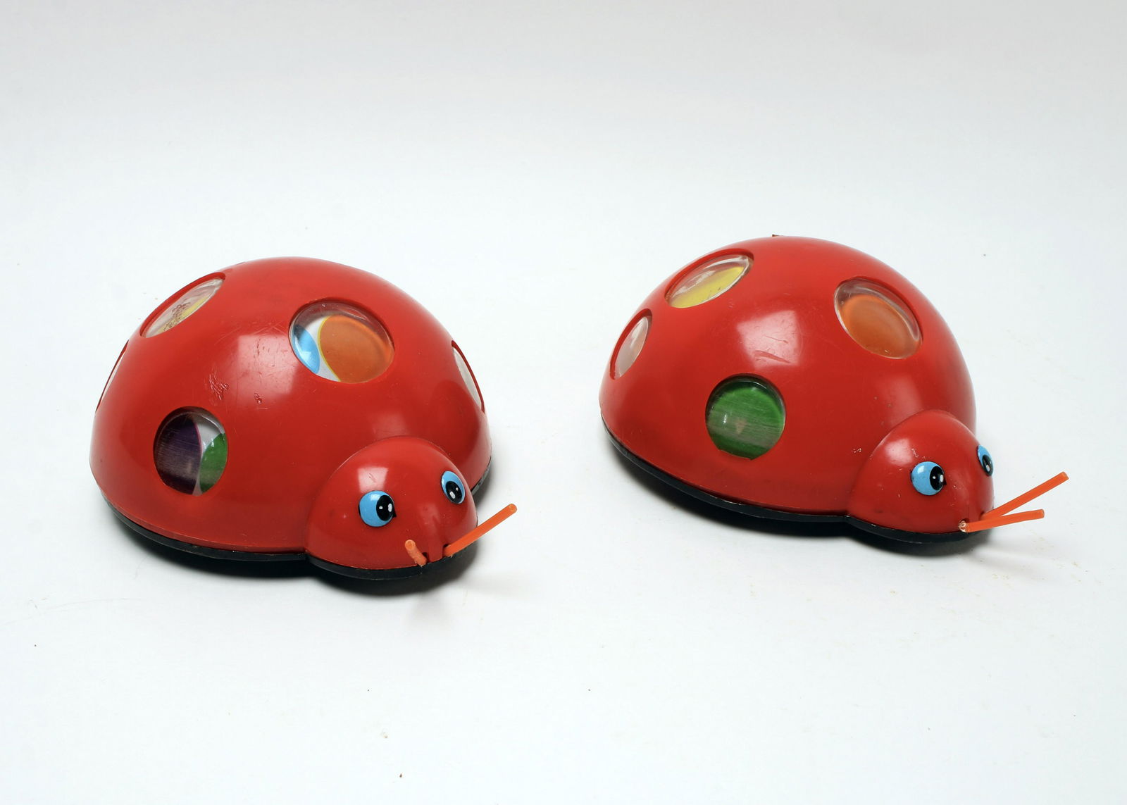PAIR VINTAGE CHILD GUIDANCE RED LADYBUG TOY: Child Guidance Red Ladybug Toy is a cute little vintage toy made in Japan. Ladybug's red shell is plastic and the bottom black panel is metal. Toy has three wheels that work on friction.&nb
