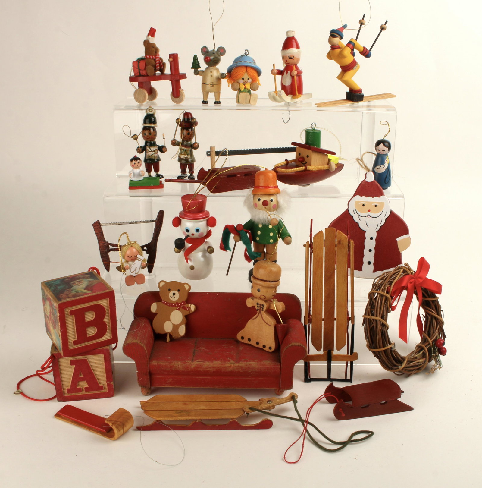 LOT VINTAGE WOODEN CHRISTMAS ORNAMENTS: Various wooden ornaments and decorations from an NY home collection. Includes wooden doll house couch. $100 - $200 Please contact us for high resolution images of this lot. Shipping: We are