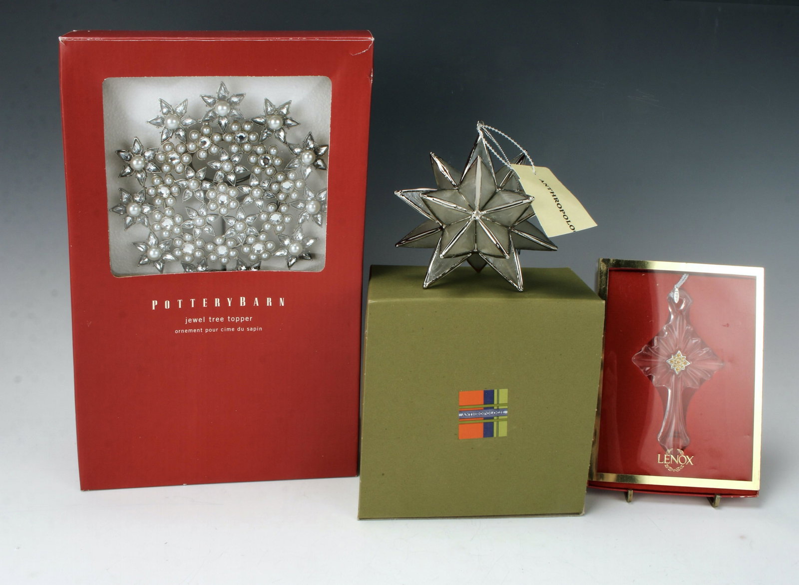 POTTERY BARN, ANTHROPOLOGIE, LENOX ORNAMENTS: Pottery Barn jewel tree topper in box, Anthropologie star, new with tag. Lenox Pave Jewels Scrolled Cross in box. 7 3/4" X 12 1/2" $40 - $80 Please contact us for high resolution imag