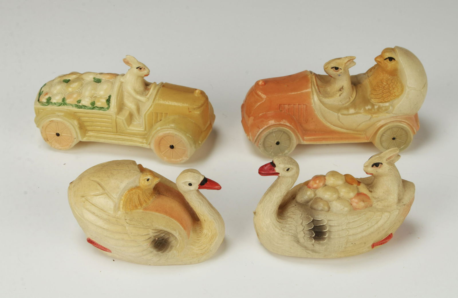 FOUR RARE EASTER CELLULOID TOYS JAPAN AUTOS SWANS: Two autos with Bunny drivers and 2 swans with a bird and Easter Bunny. 3 1/2" $100 - $200 Please co