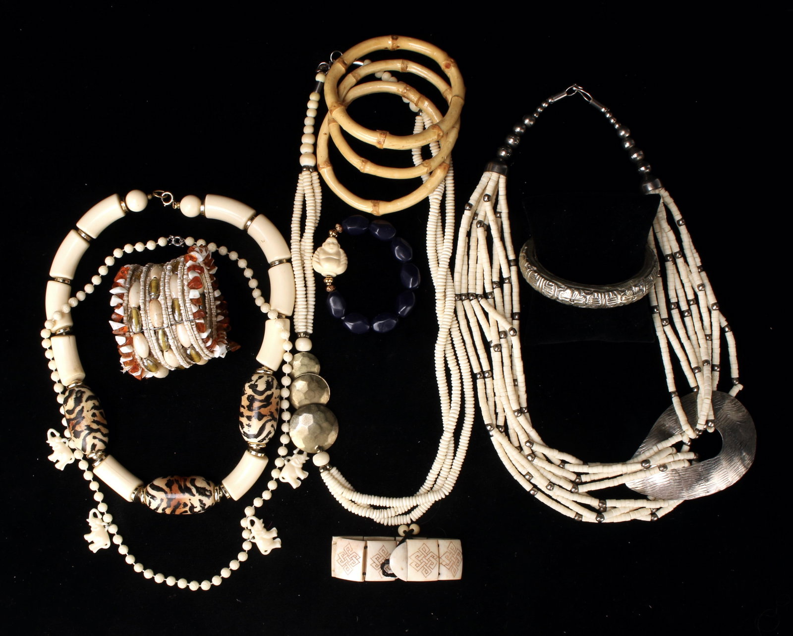 LARGE TRIBAL COSTUME JEWELRY LOT: Bamboo bracelets, bone necklaces, multiple strand necklaces. Seven bracelets and four necklaces. For you or any other wild thing you know! Provenance: Major NYC fashion and antiques collector. Primari