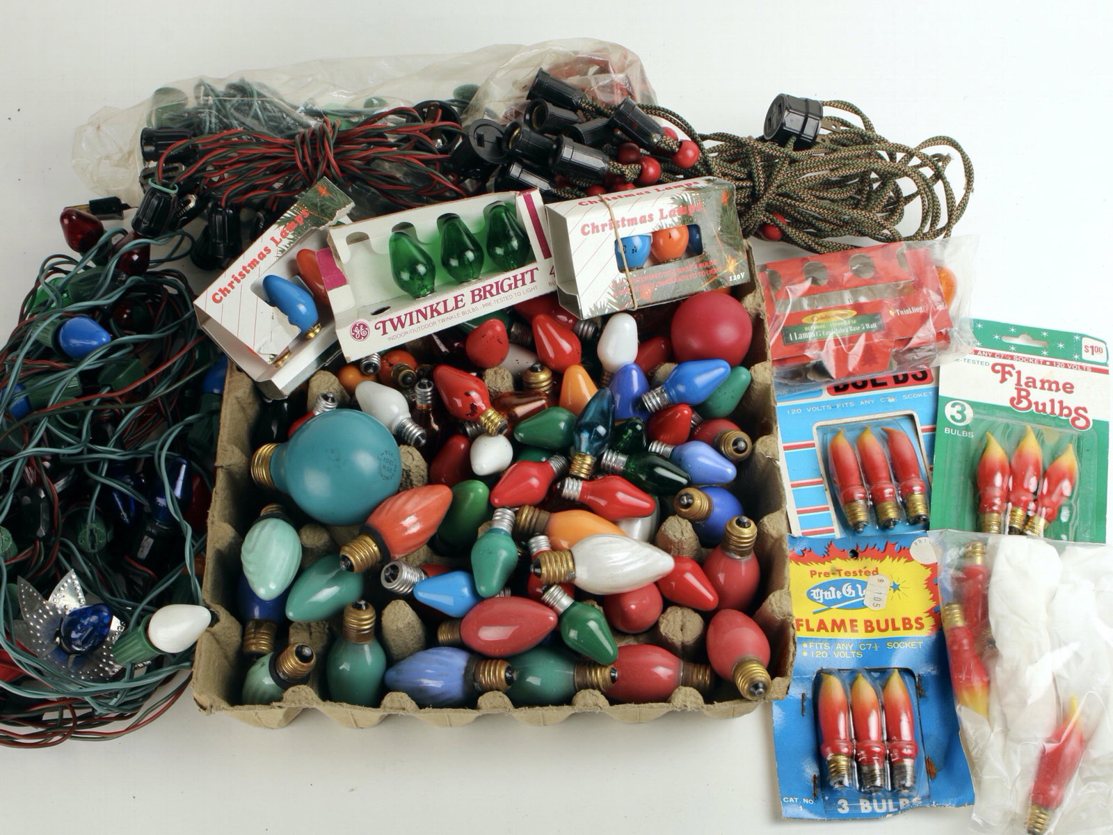 LOT VINTAGE CHRISTMAS LIGHTS BULBS: Including bulbs, flame bulbs, vintage strands, and more from an NY home collection. $100 - $200 Please contact us for high resolution images of this lot. Shipping: We are able to pack and sh