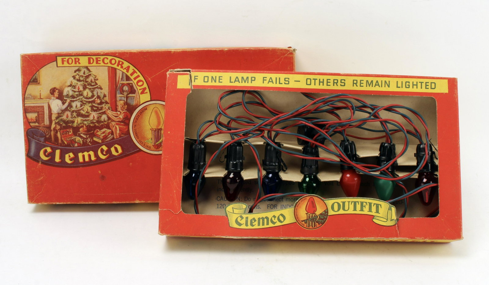 VINTAGE CLEMCO OUTFIT XMAS LIGHTS IN ORIGINAL BOX: Original box reads "Lighting Outfit for Your Christmas Tree". 13" X 7" $20 - $40 Please contact us for high resolution images of this lot. Shipping: