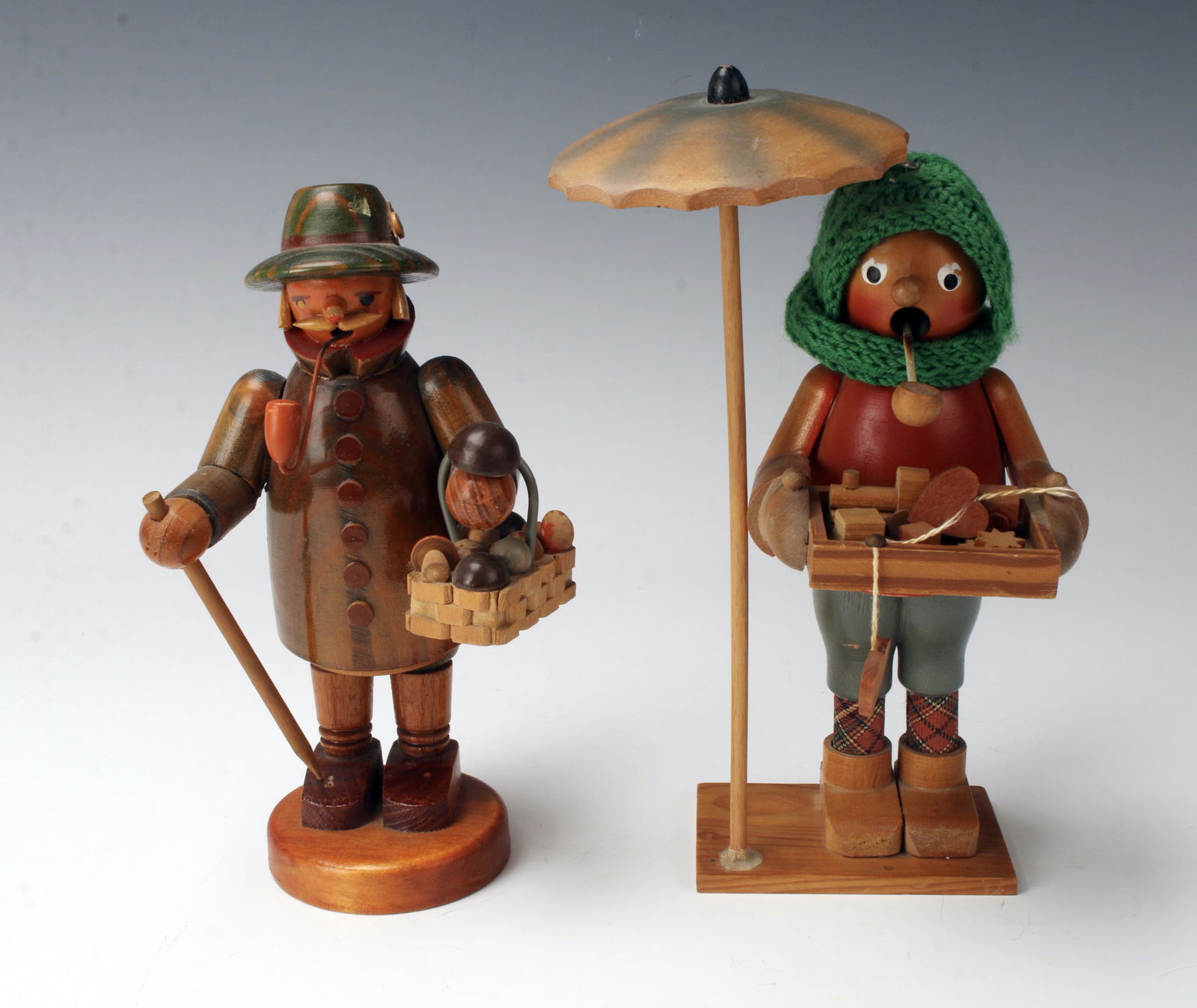 2 VINTAGE WOODEN GERMAN SMOKERS: One is a mushroom farmer, the other is a toy peddler. Made of painted wood. 4 1/2" X 7 1/2" $100 - $200 Please contact us for high resolution images of this lot. Shipping: