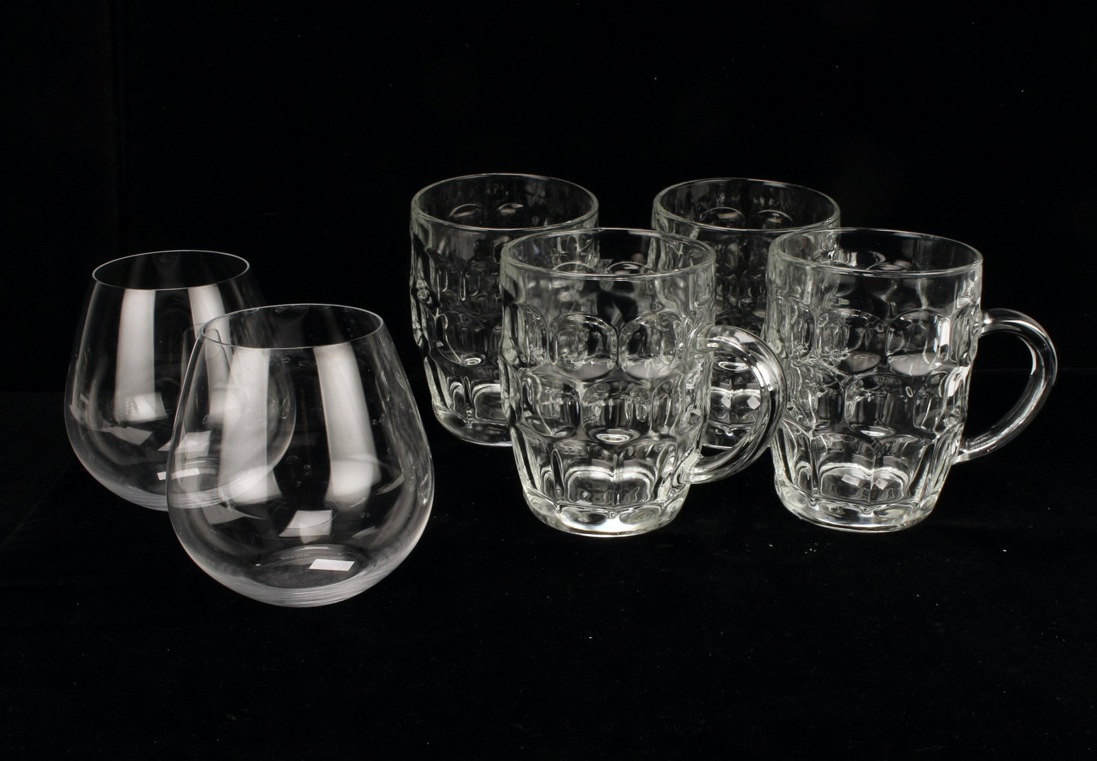 PAIR RIEDEL RED WINE & 4 FRENCH BEER MUGS: Riedel stemless red wine glasses and four French beer mugs. 5 1/2" X 5" $40 - $80 Please contact us for high resolution images of this lot. Shipping: We a