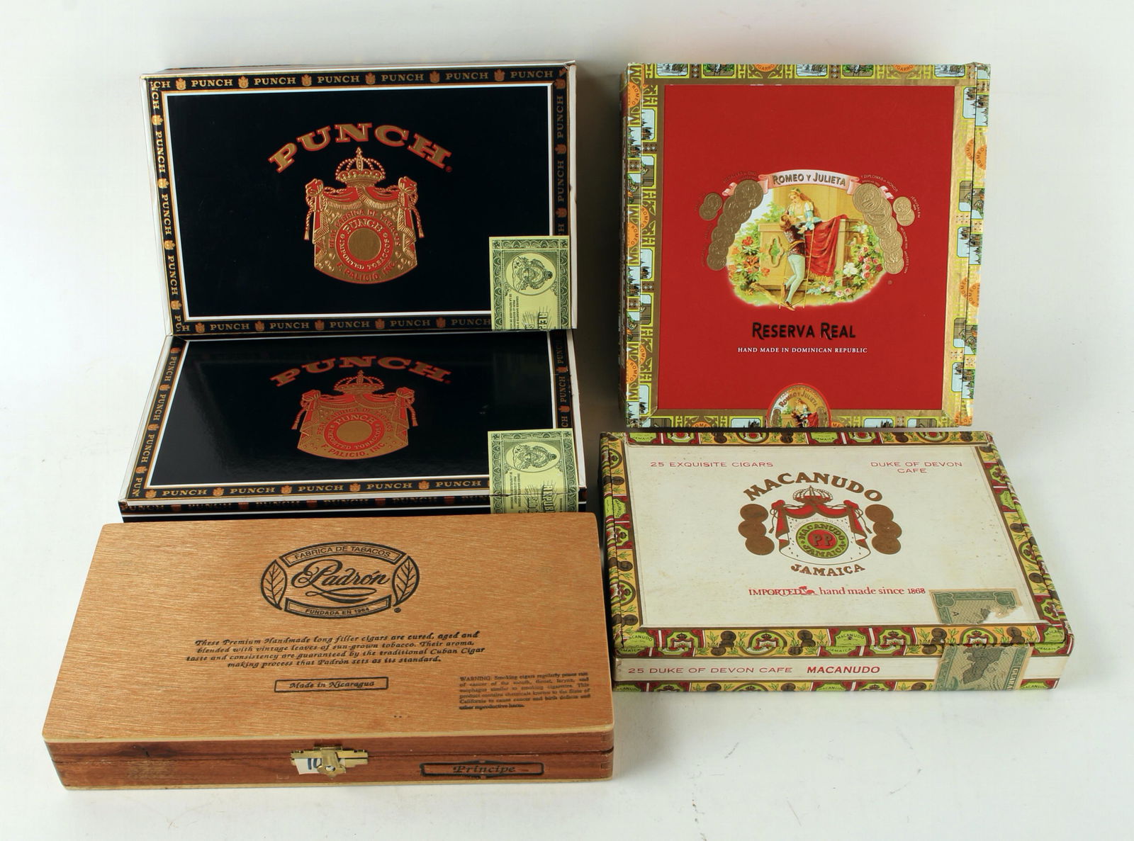 LOT OF VINTAGE CIGAR BOXES: Including Romeo y Julieta, Macanudo, 2 Punch, and Padron. 7 1/2" X 7 1/2" $20 - $40 Please contact us for high resolution images of this lot. Shipping: W