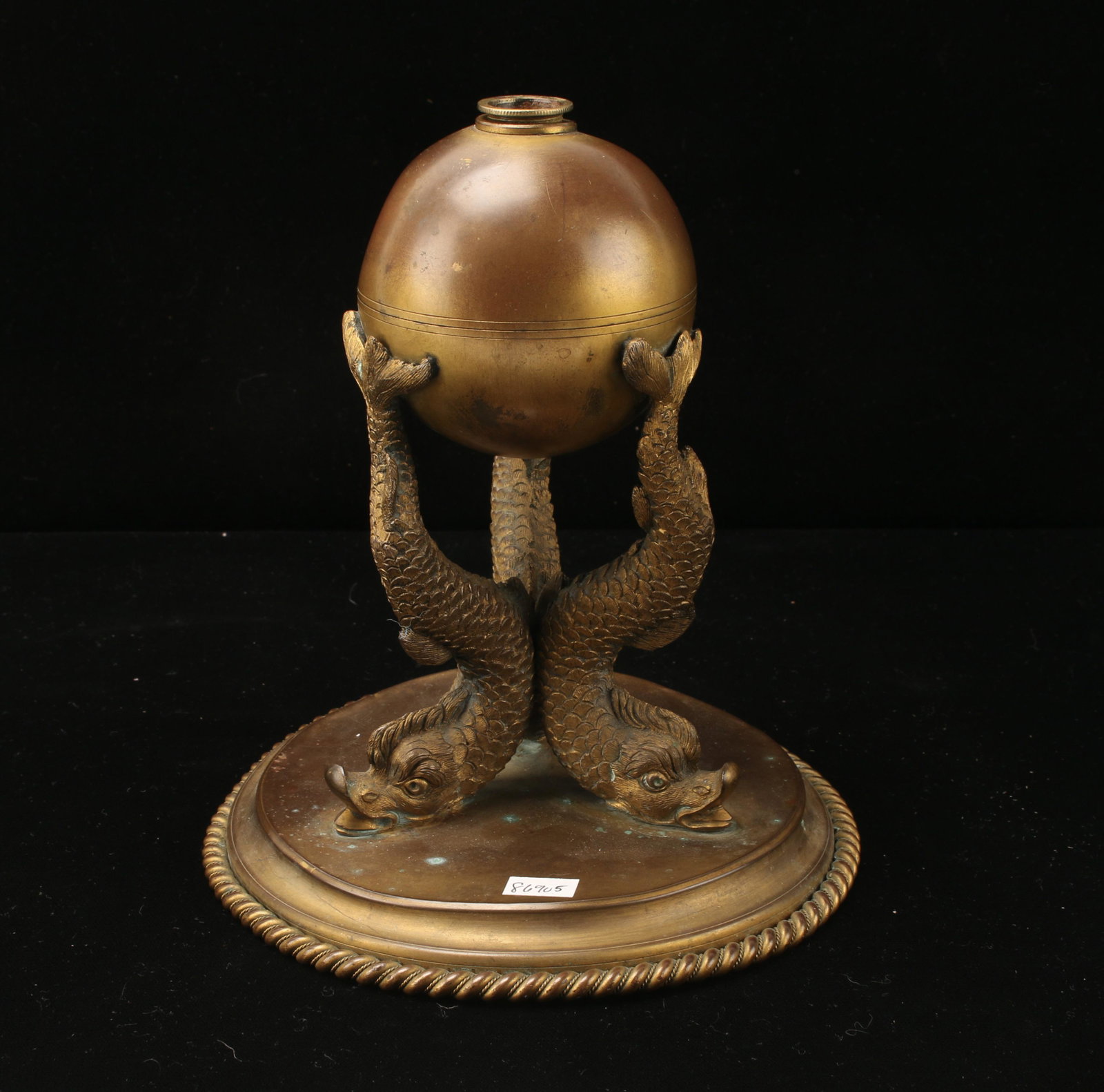 FRENCH FIRE GILDED BRONZE DOLPHIN LAMP BASE: Three dolphins supporting an orb with their tails. With rope trim around the base. 7 1/2" X 9" $100 - $200 Please contact us for high resolution images of this lot. Shipping: