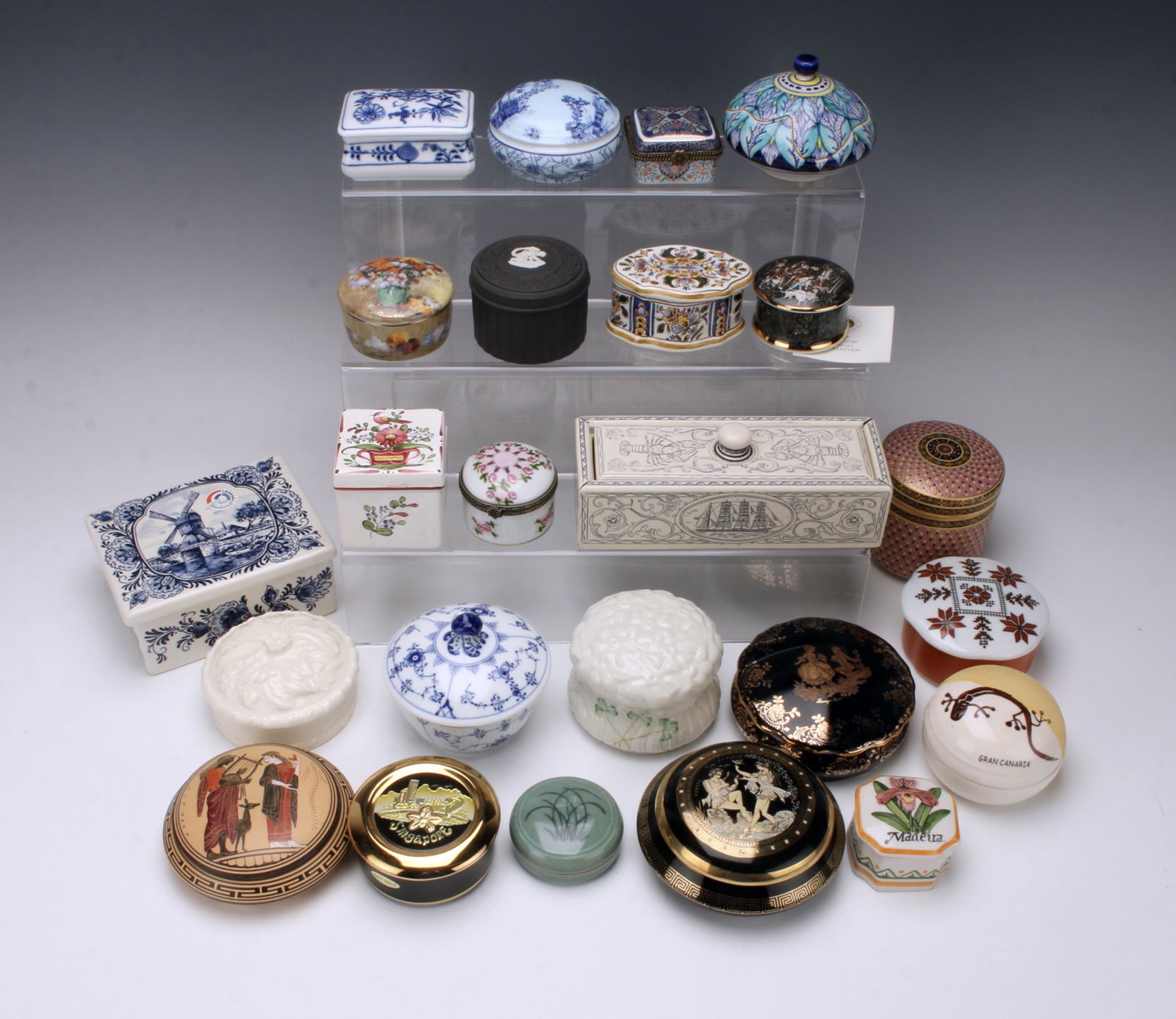 24 PORCELAIN BOXES FROM AROUND THE WORLD: Exceptional lot of ceramic and porcelain boxes from around the world. Greece, Singapore, Korea, France, England, Denmark, Ireland, Germany, Holland, Denmark, Scotland, Italy, Portugal, Thailand, Eston