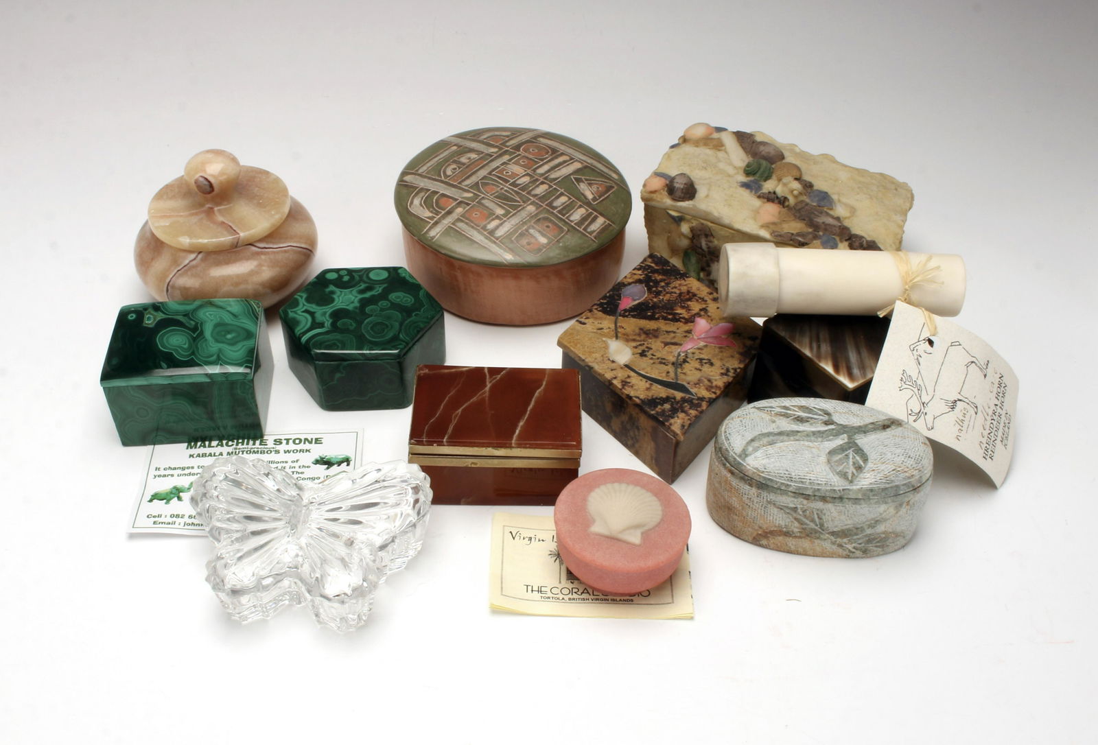 BOXES FROM AROUND THE WORLD: In stone, ceramic, crystal, and horn. 2 Malachite from the Congo, ceramic from Uruguay & Jamaica, Stone from India, Venezuela, Turkey, Coral from Tortola, horn from Iceland & Haiti, plus an ag