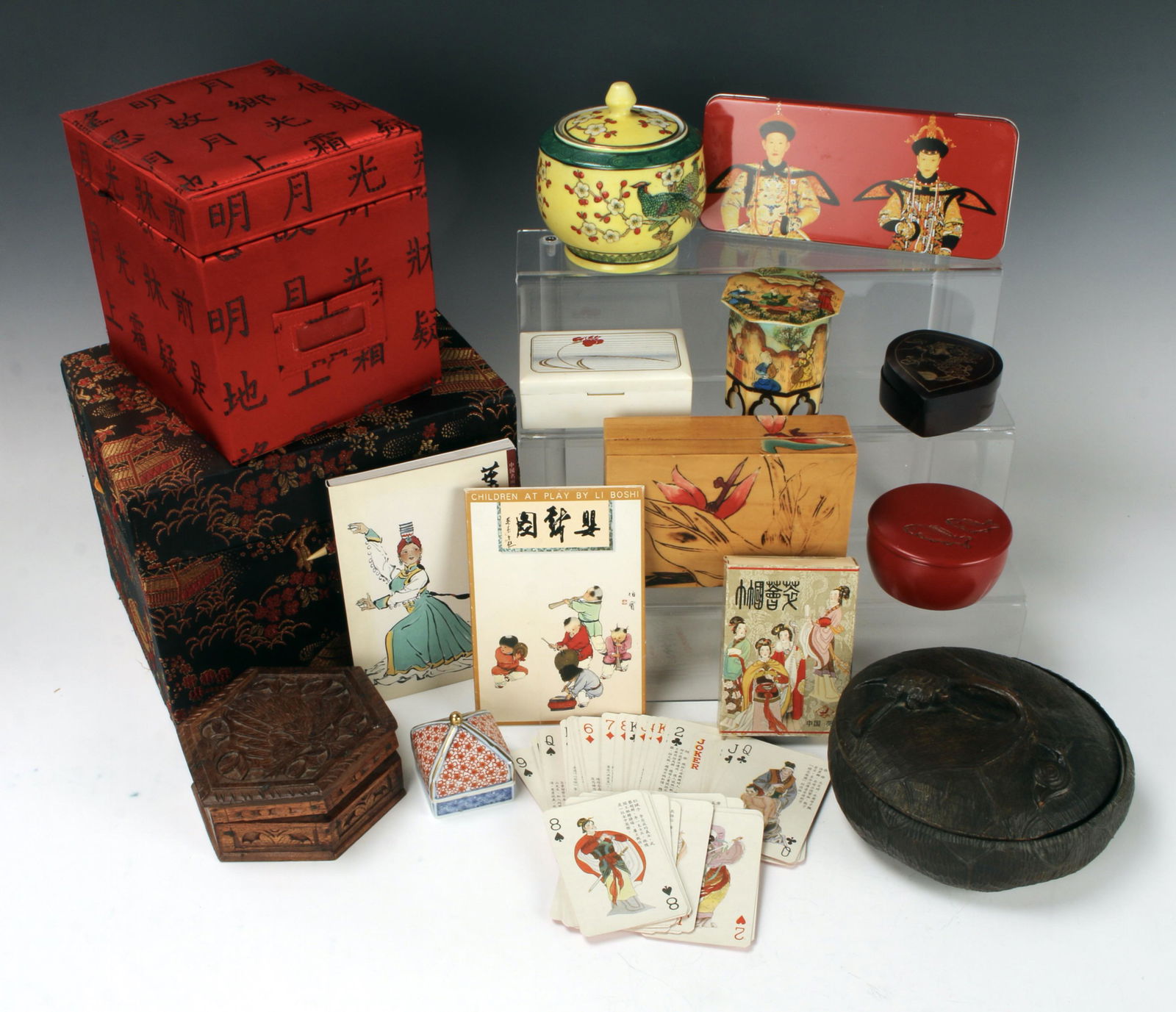 LOT OF DECORATIVE BOXES: fabric covered, wood, lacquer, tin, and porcelain boxes. Includes playing cards. 9" X 7" $20 - $40 Please contact us for high resolution images of this lot. Shipping: